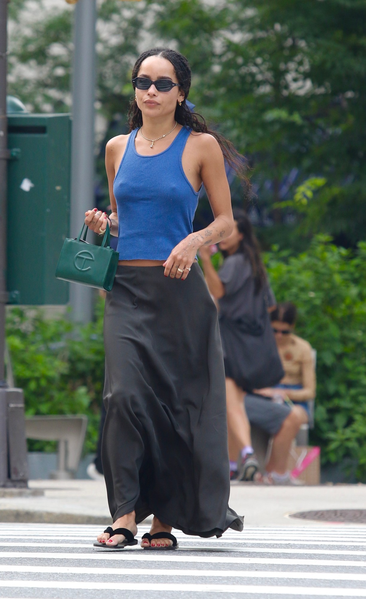 zoe kravitz walking in nyc in a tank top and carrying a telfar bag 2021