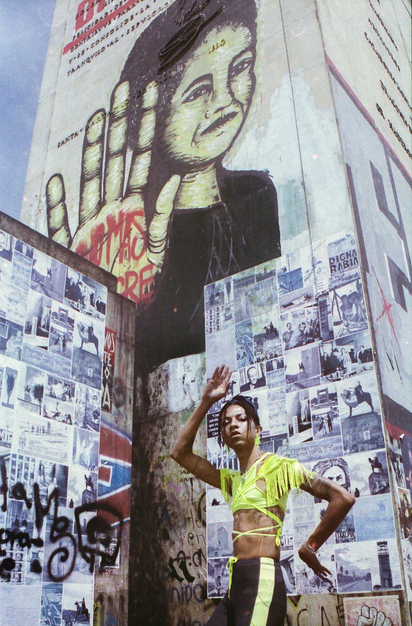 portrait of lomaasbello in front of street art in bogota colombia