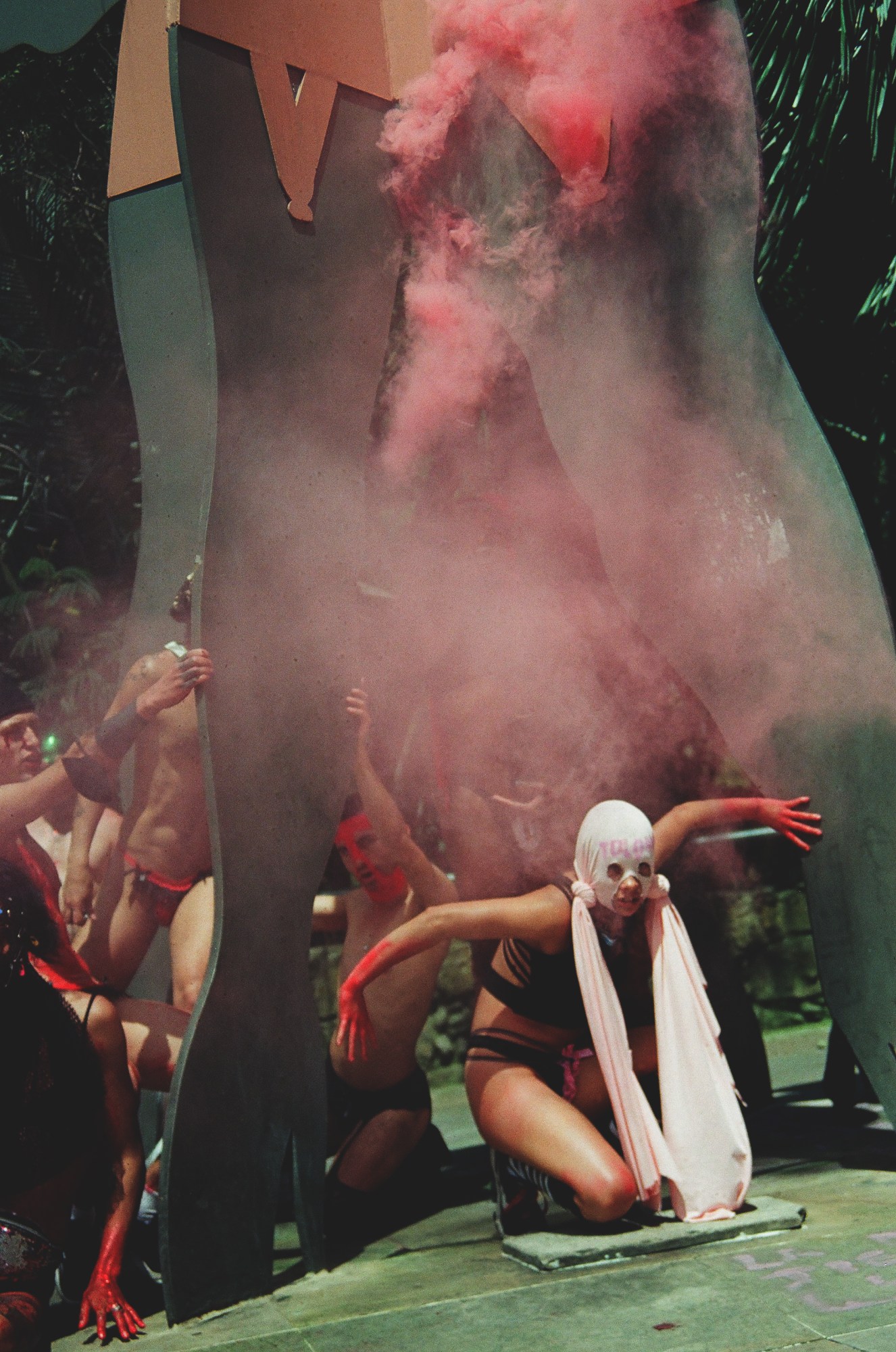 colombian queer activists wearing face masks and protesting in the street