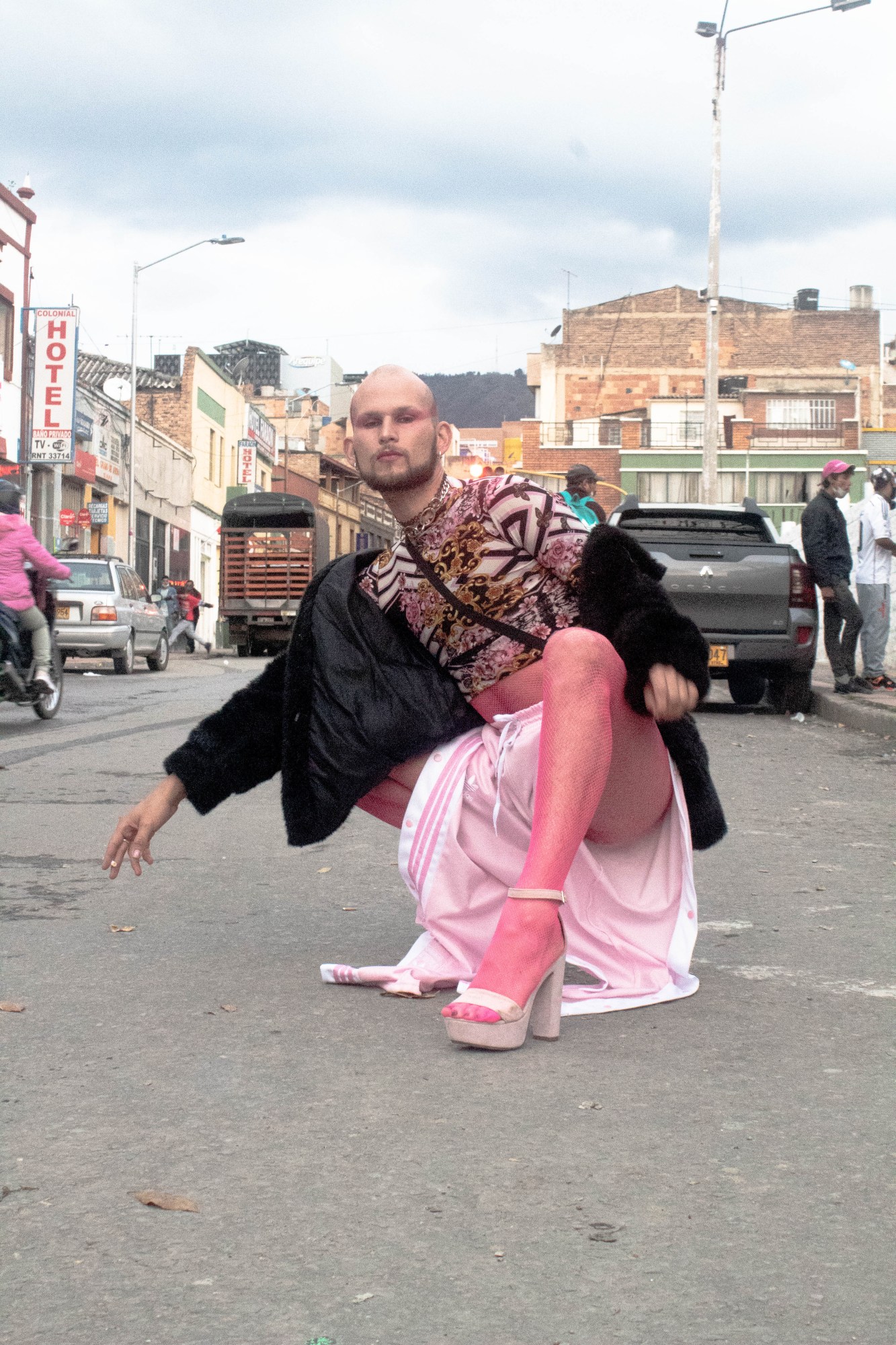 photo of queer organizer demonia wearing heels at a protest in bogota colombia