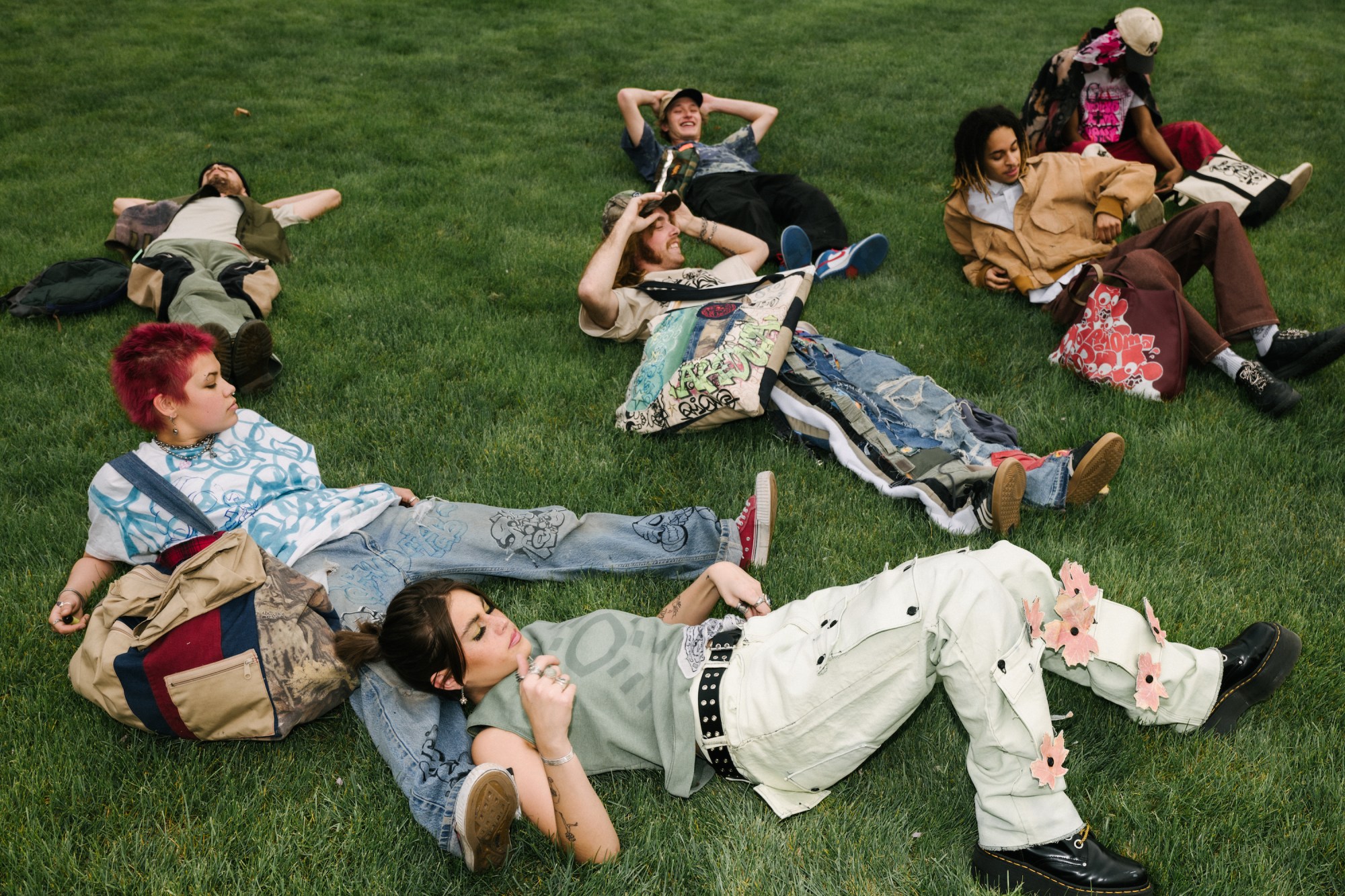 teens laying on the grass in salt lake city utah by blake lewis