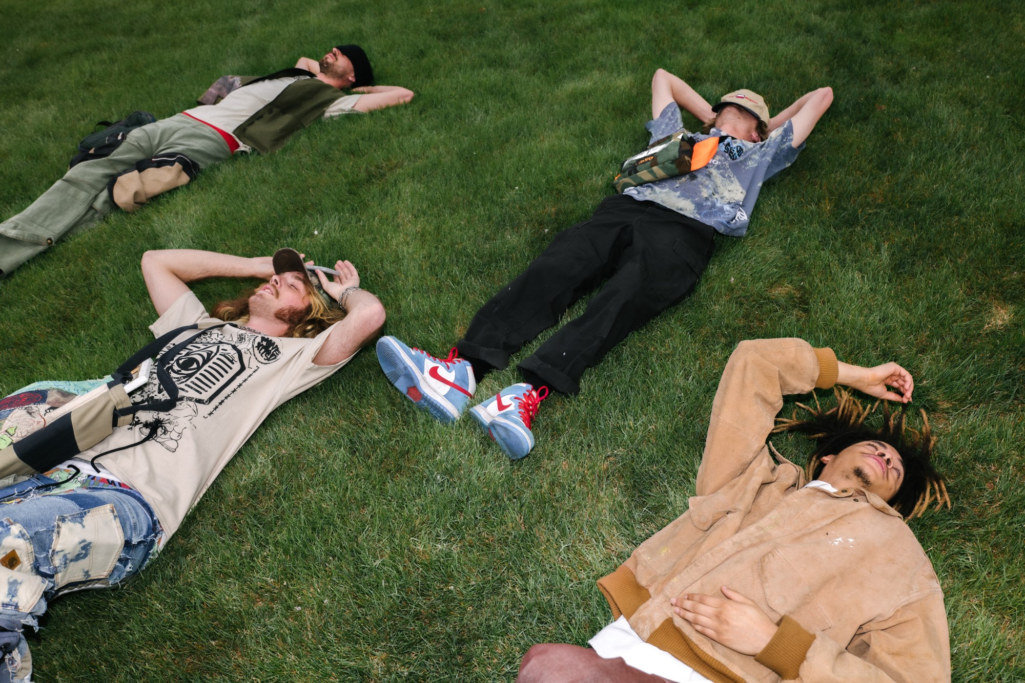 teens laying on the grass in salt lake city utah by blake lewis