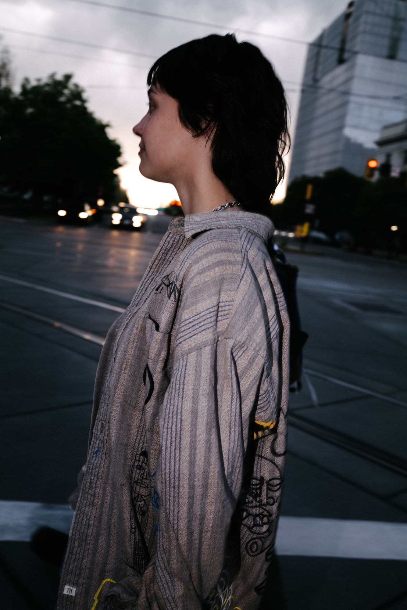 a side profile of a girl wearing a handpainted shirt in salt lake city utah by blake lewis