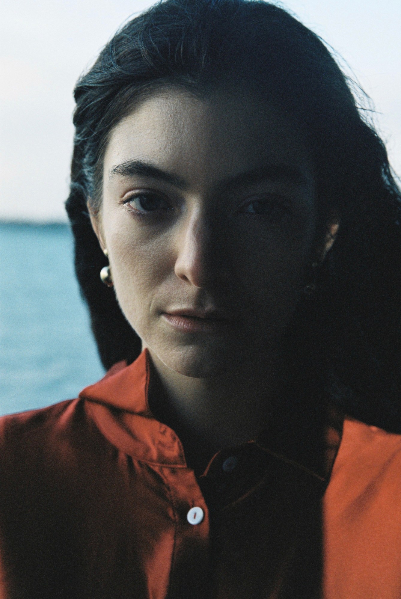 lorde 2021 photo looking into the camera solar power