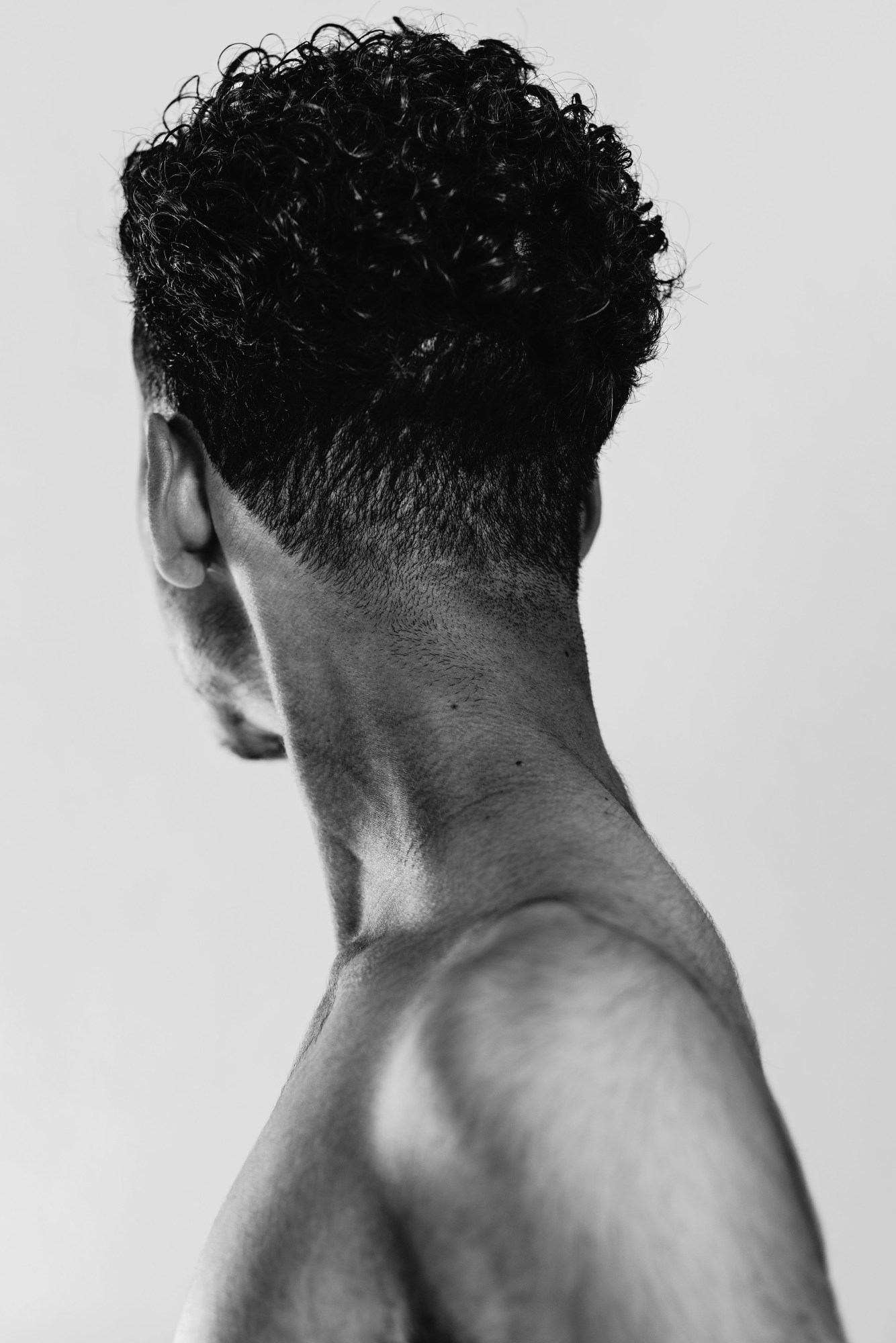 the back of a person's head and shoulders