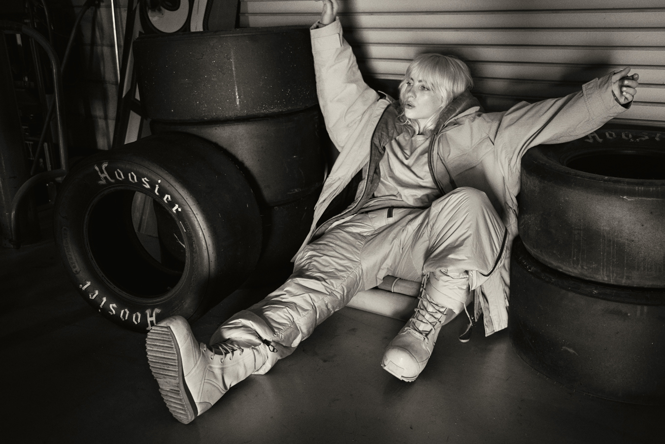 billie eilish surrounded by car tires