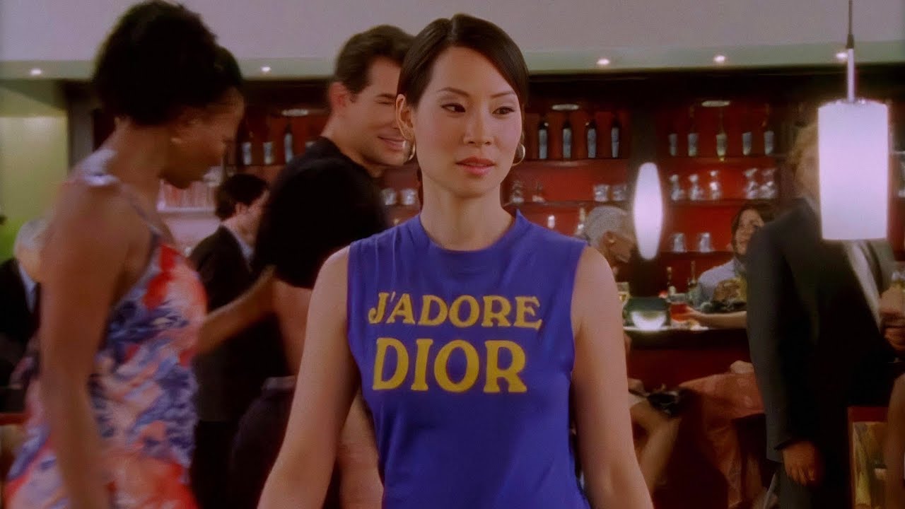 Lucy Liu wearing a J'ADORE DIOR tank top in a scene from SATC