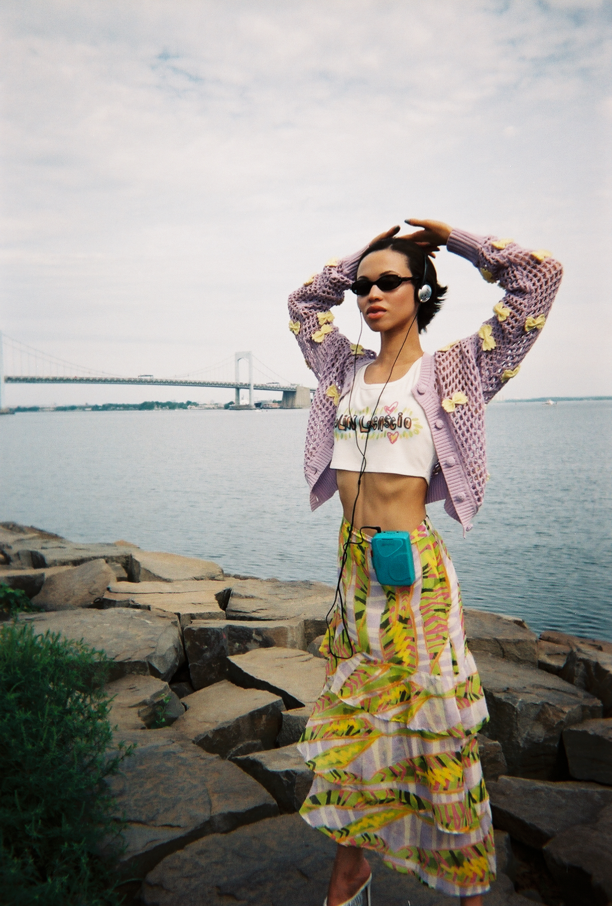 a model posing in front of a bridge wearing colin locascio