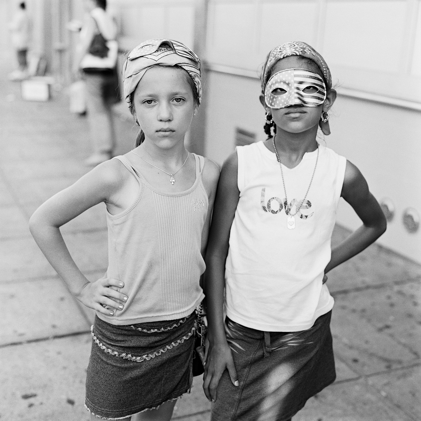 two young girls wearing bandanas and one wearing an eye-mask