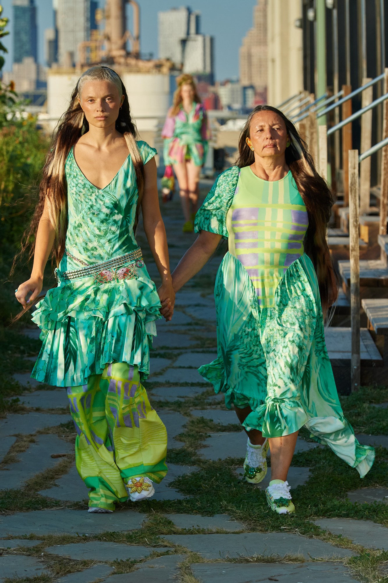 models walking down the runway outside wearing collina strada ss22