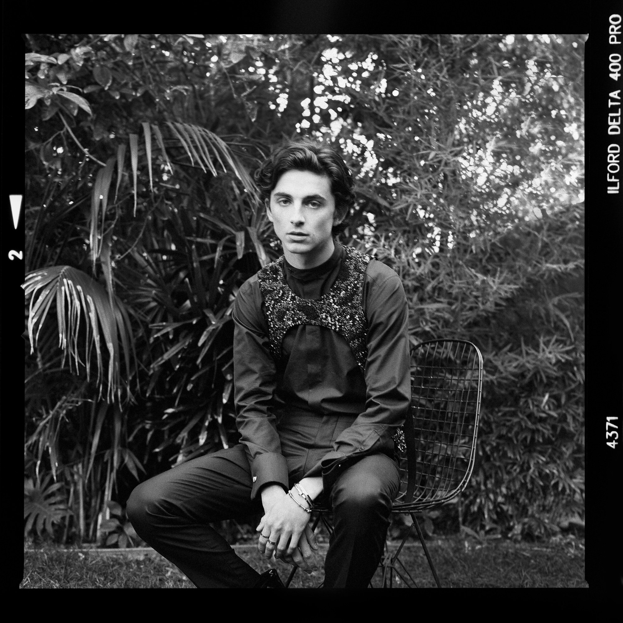 A black and white portrait of Timothée Chalamet shot for Cartier