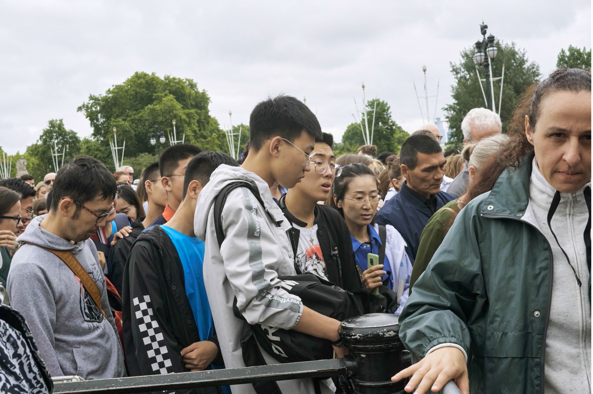 a large crowd of people queuing for something