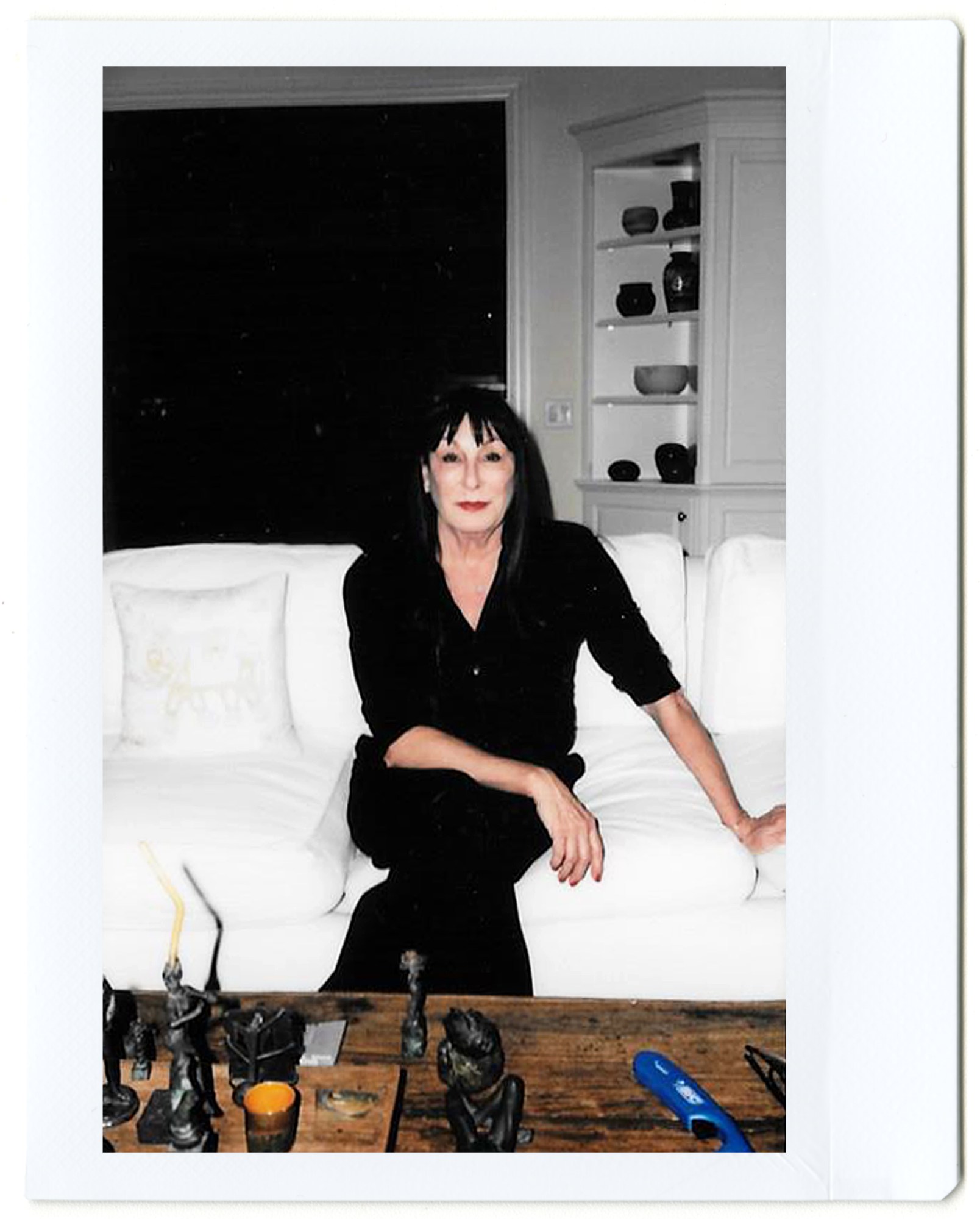 a polaroid portrait of anjelica huston sitting on a couch by hugo huerta marin