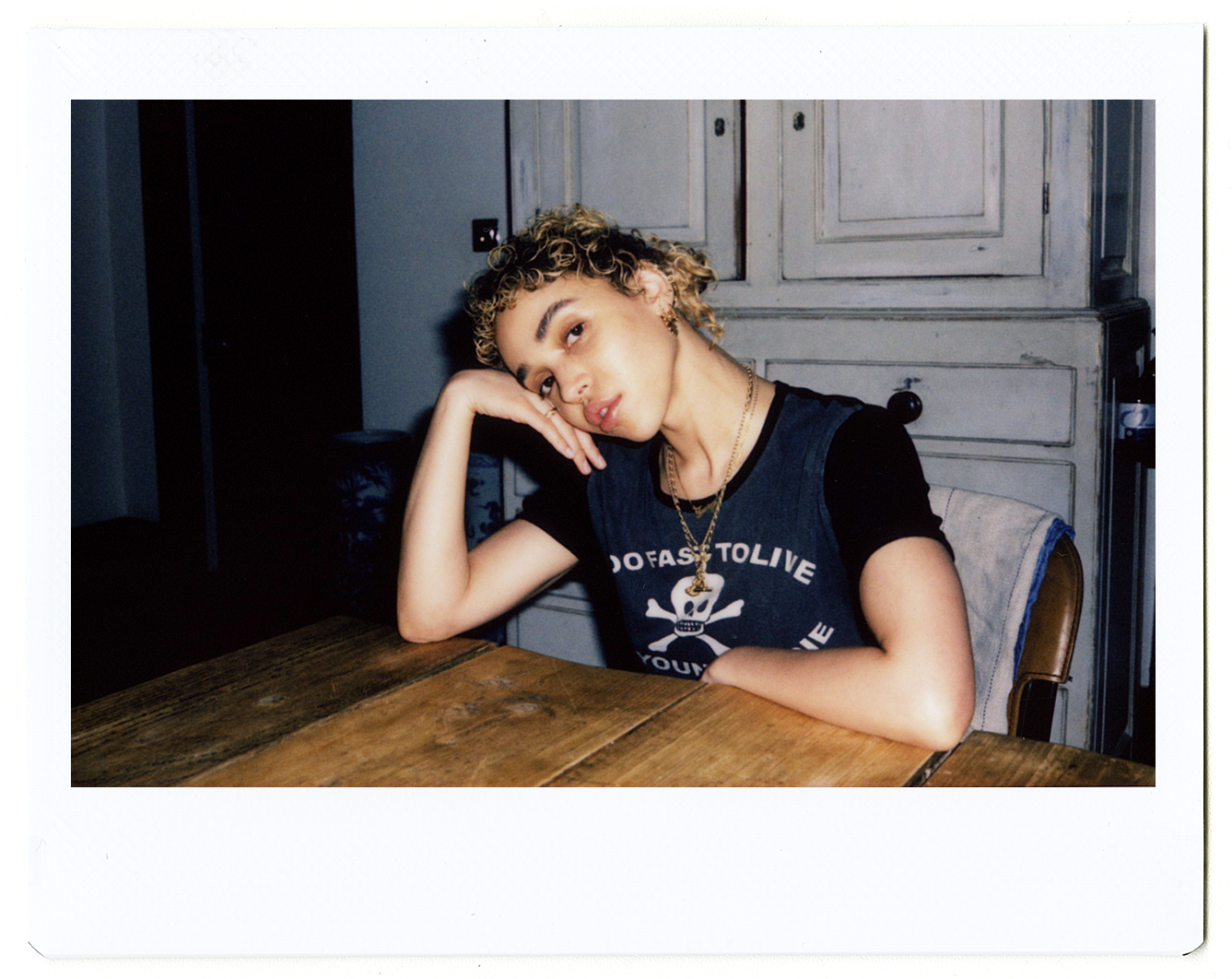 a polaroid portrait of fka twigs at the table by hugo huerta marin