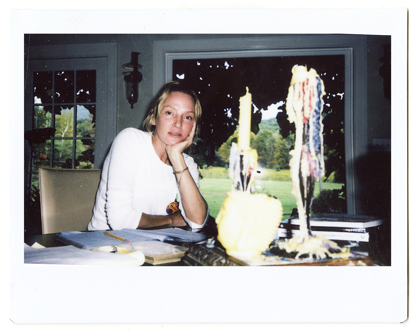 a polaroid portrait of uma thurman at the table by hugo huerta marin