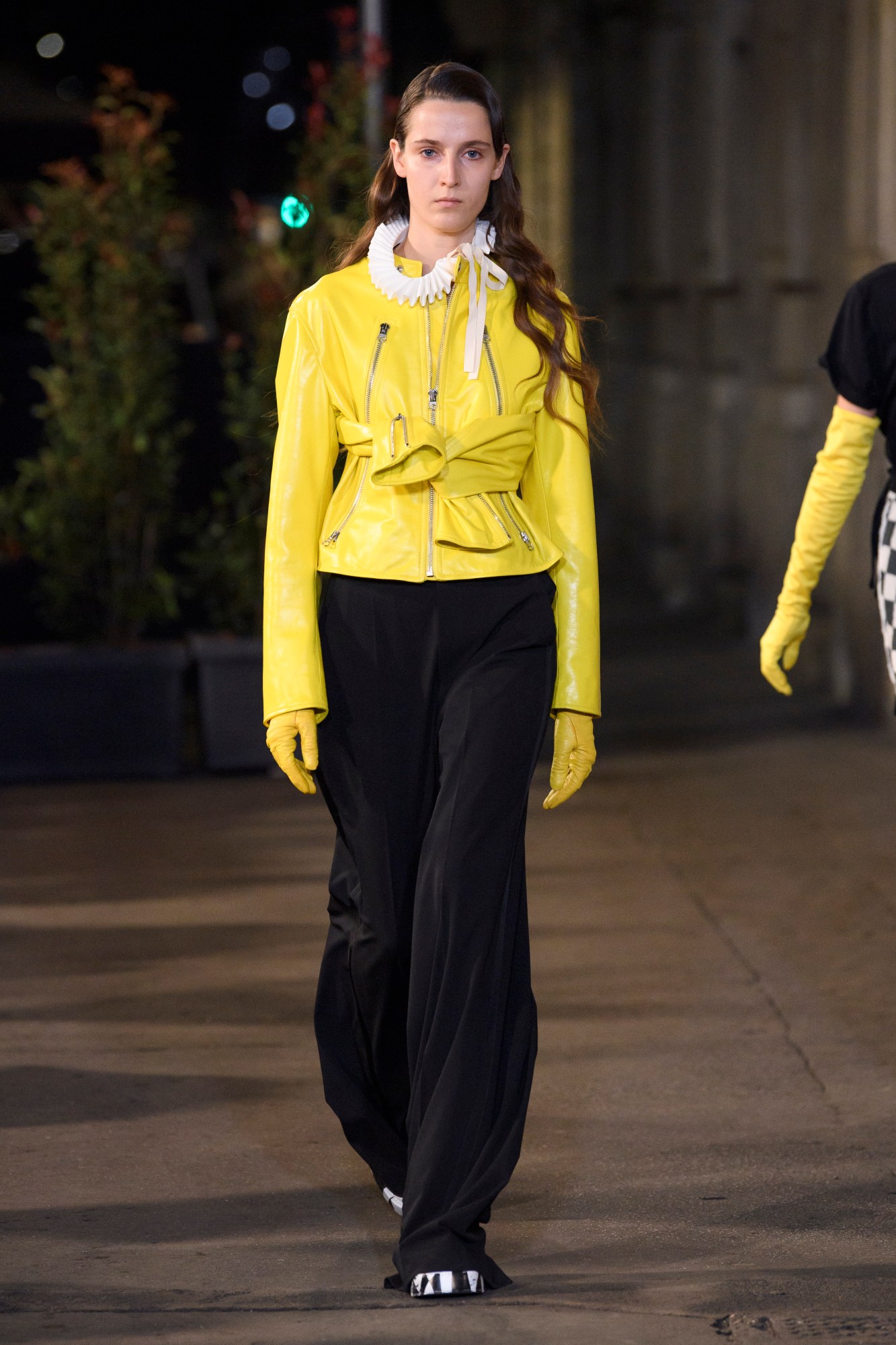 A model walking the runway at MM6 SS22