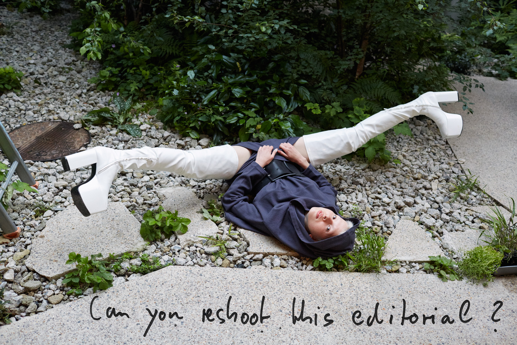 a model lies on her back in thigh high white boots, with the words 'can you reshoot this editorial?' over it