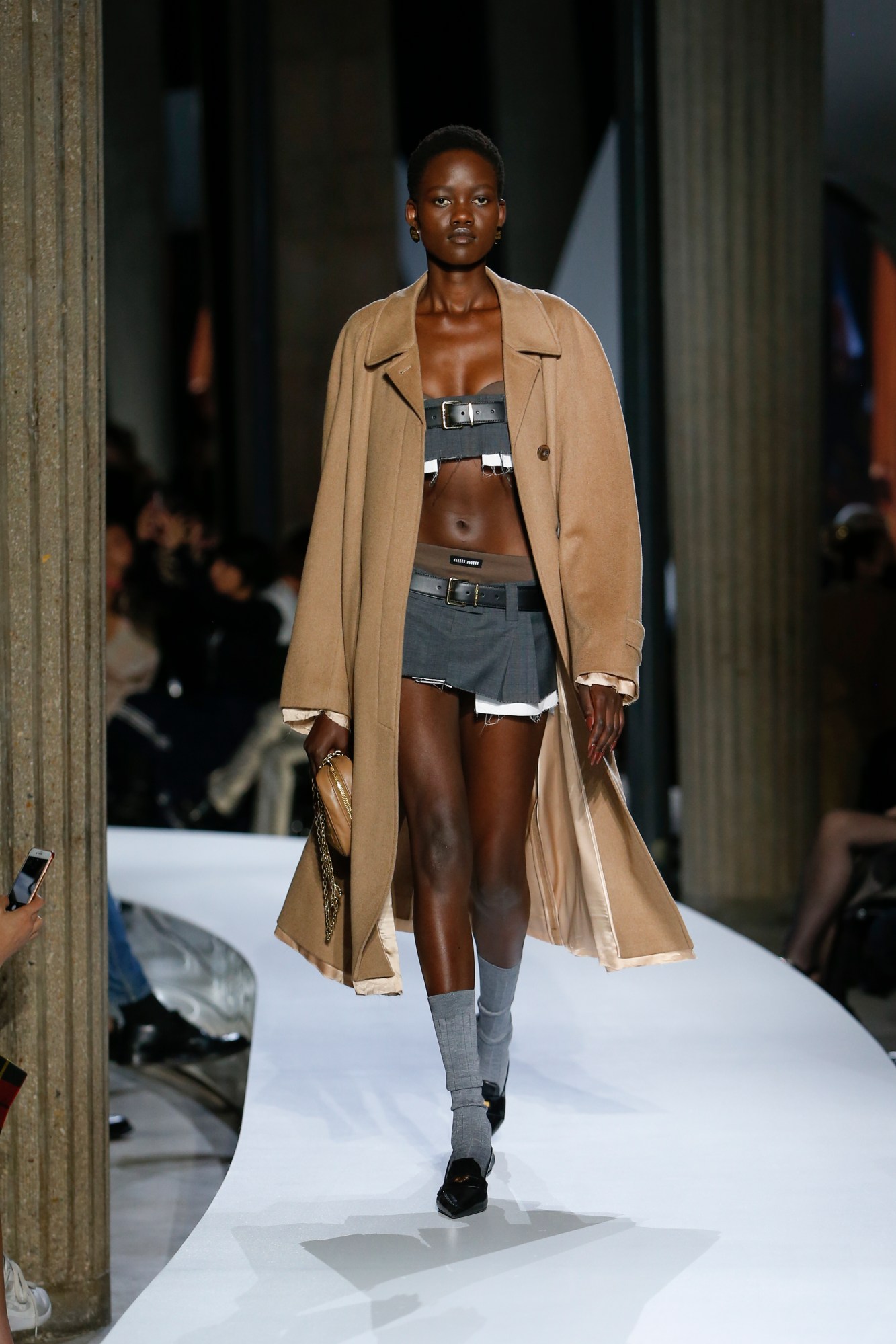 A model walking the runway at Miu Miu SS22