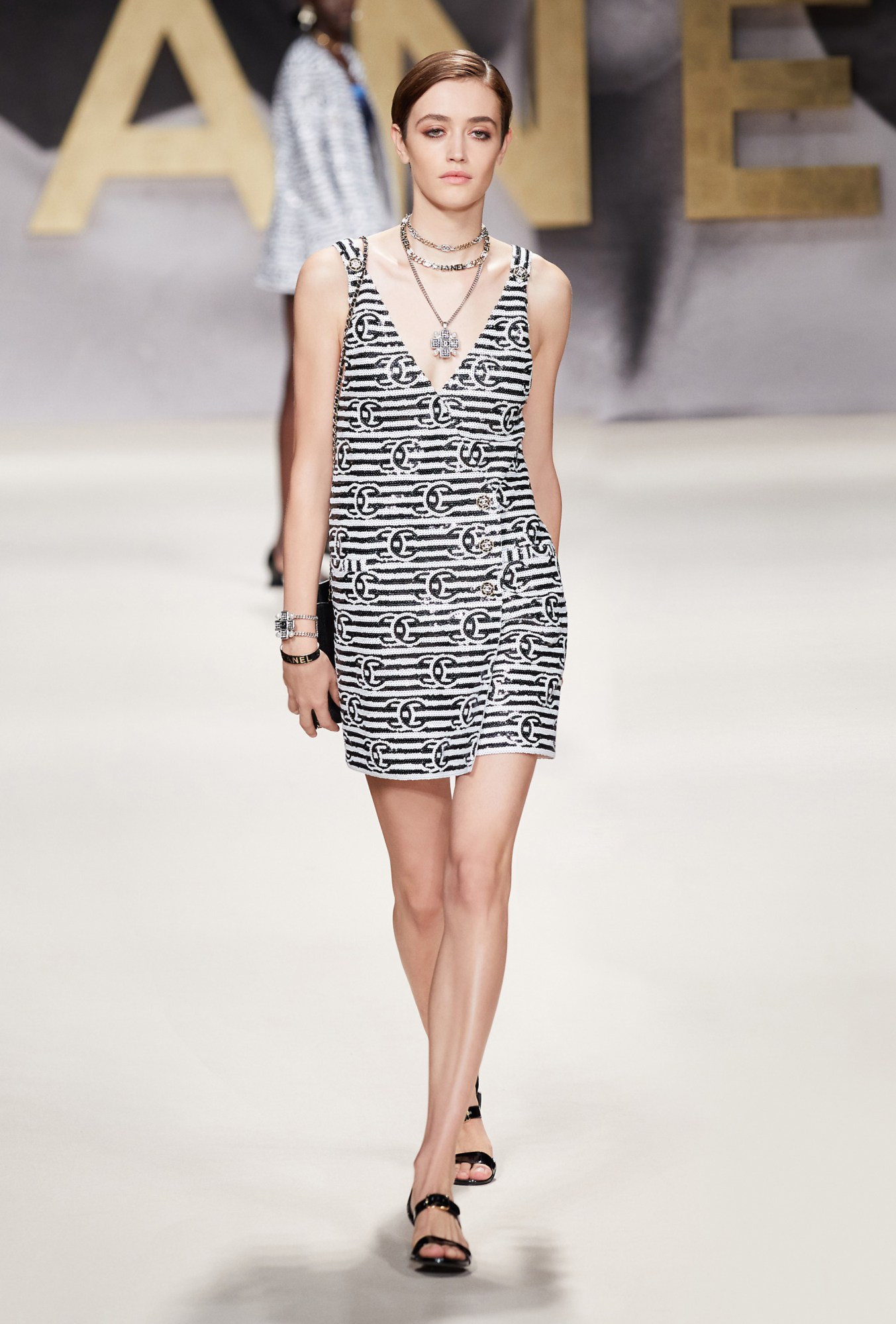 A model walking the runway at Chanel SS22