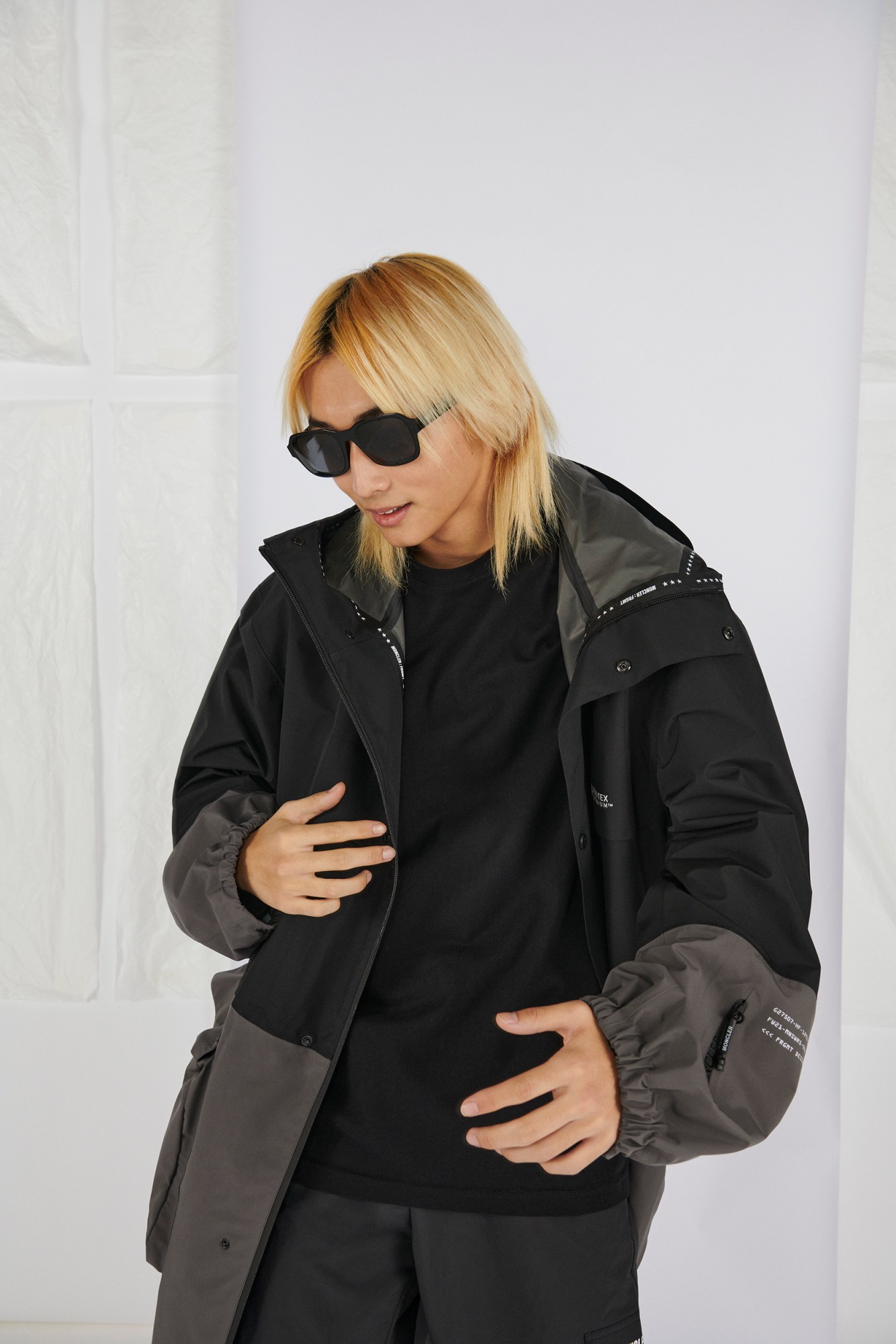 Model wears top and coat by 7 Moncler Frgmt Hiroshi Fujiwara