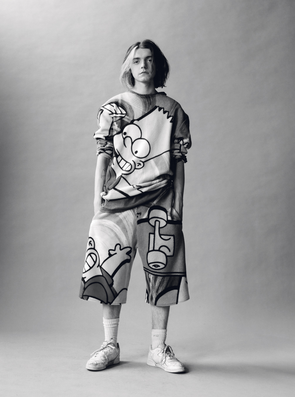 Lola + Pani photograph of a young model wearing a jumper and shorts with bart simpson on them