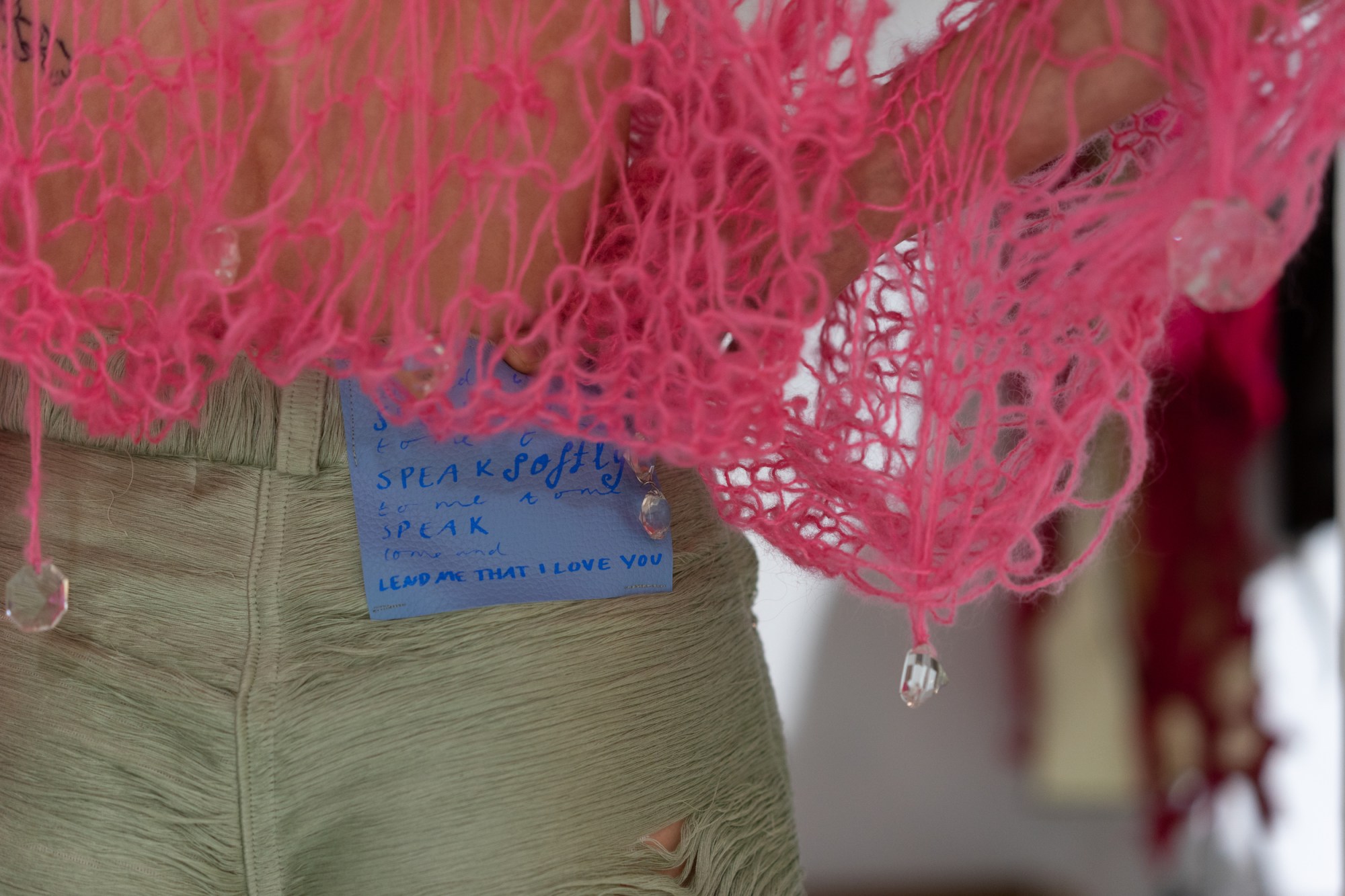 a close up of a poem on constanca entrudo's ss22 clothing label