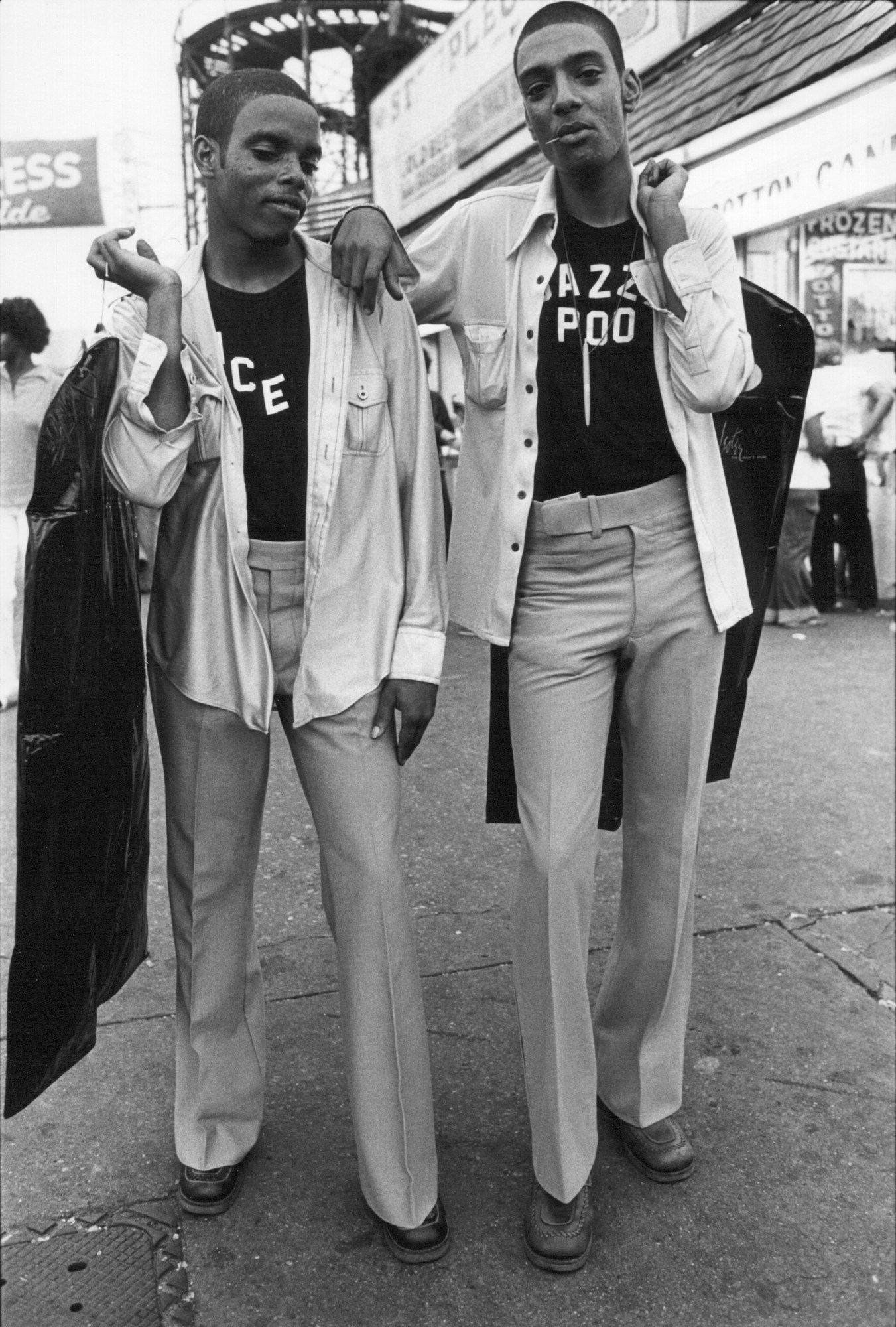 two brothers in matching outfits on coney island