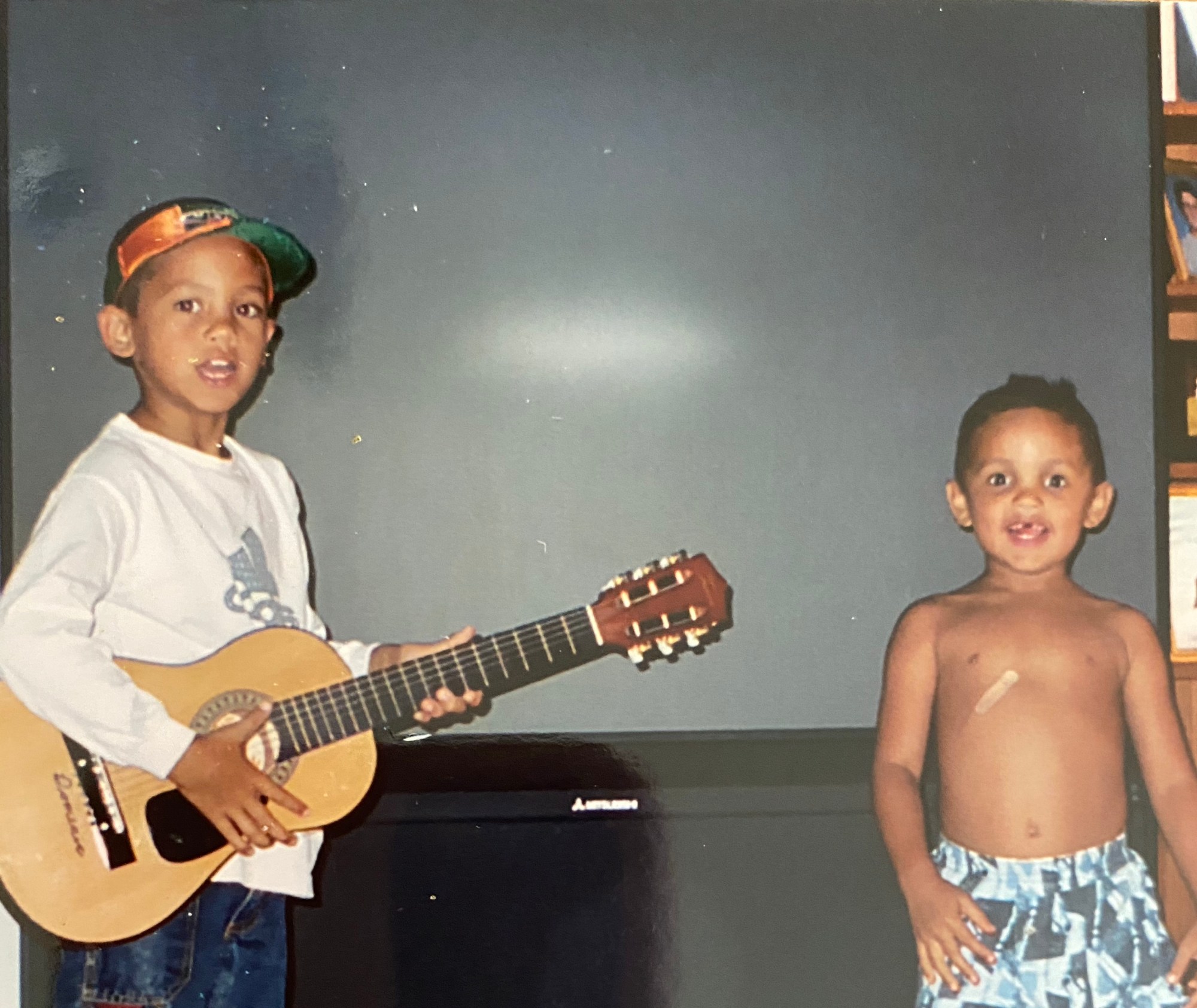 a photo of alex and dominic fike playing music as kids