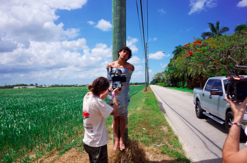 alex fike ducktaped to a telephone pole