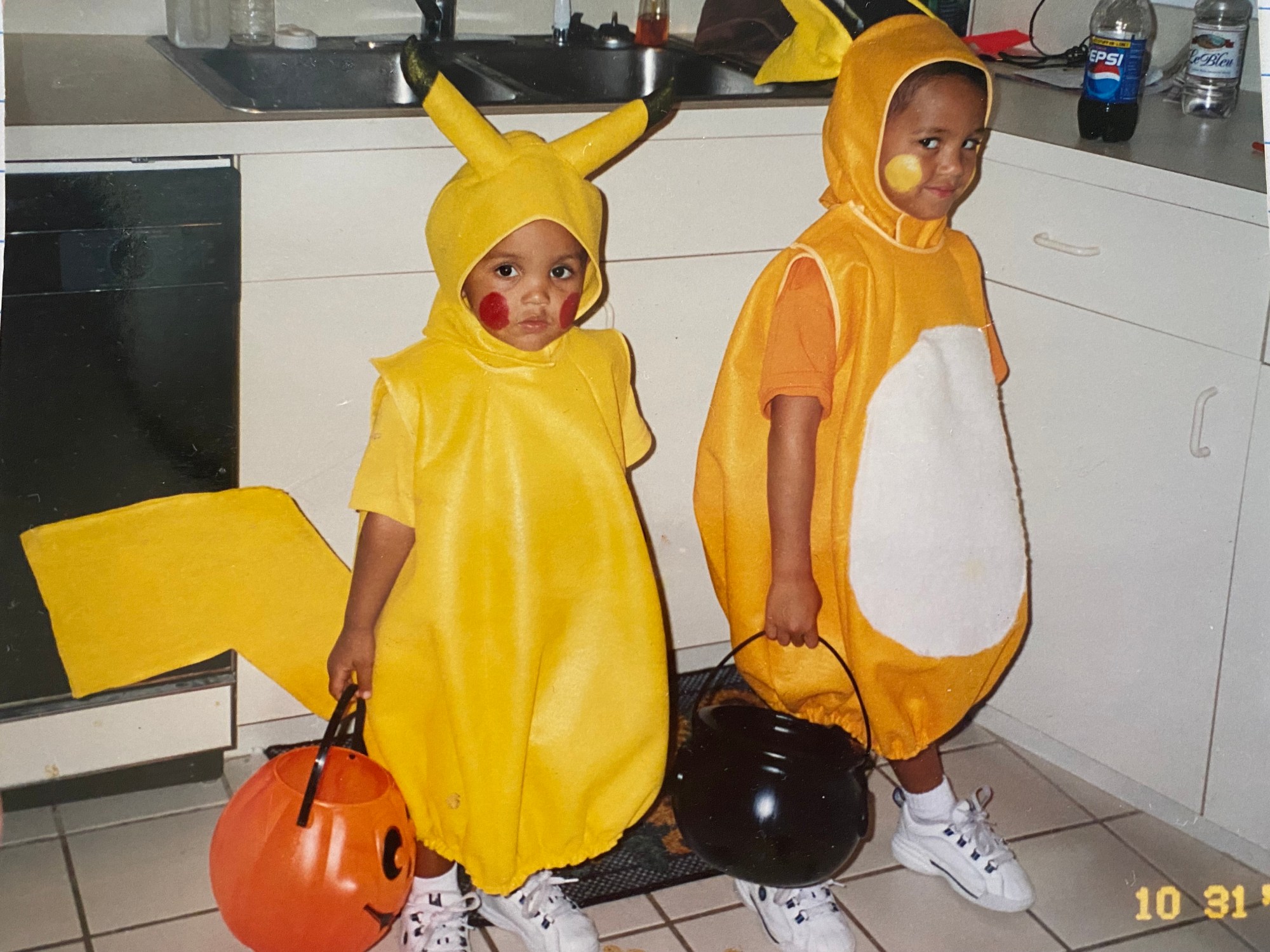 a photo of alex and dominic fike in halloween costumes as kids