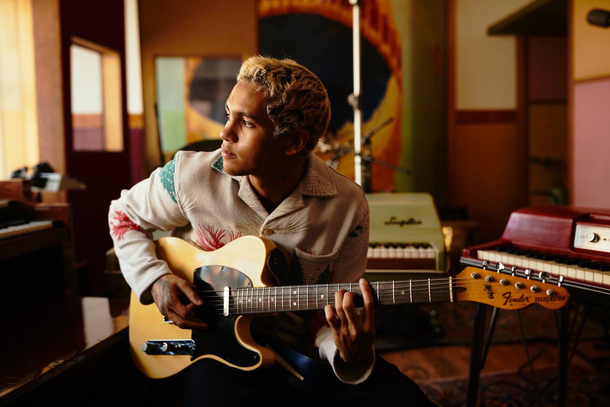 dominic fike playing guitar in the studio