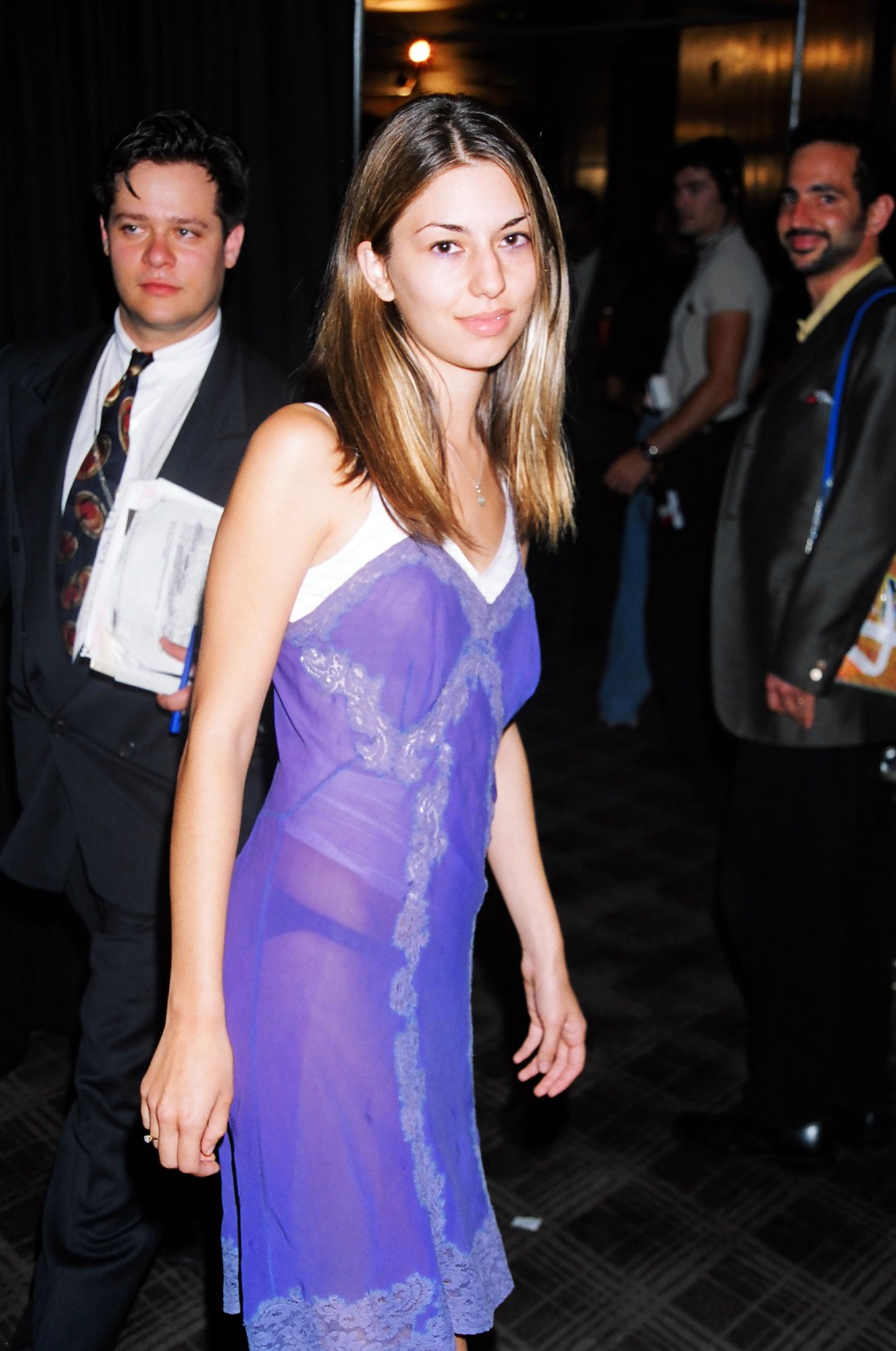 sofia coppola looking into the camera in a sheer 90s slip dress at the mtv vmas 1995