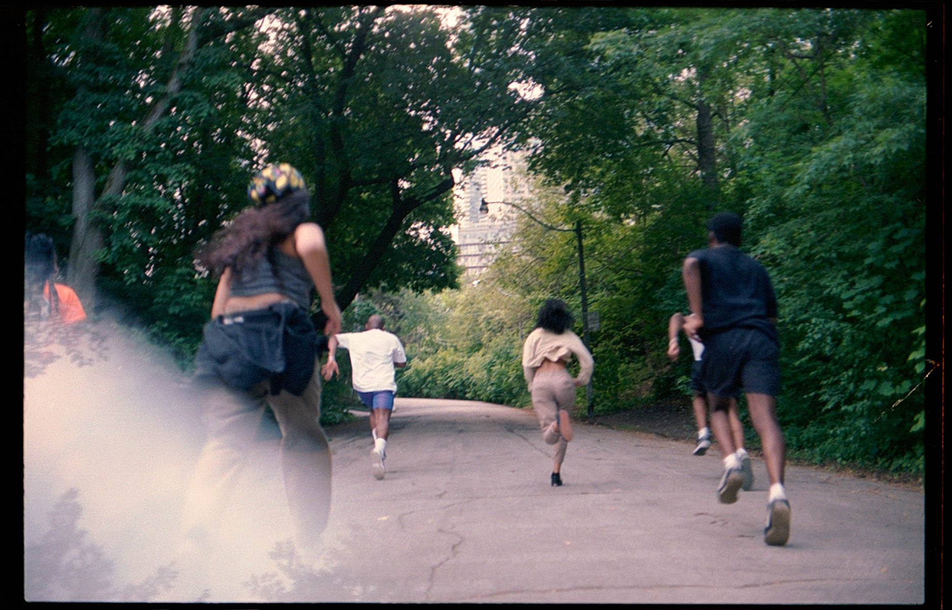 a group runs through a park