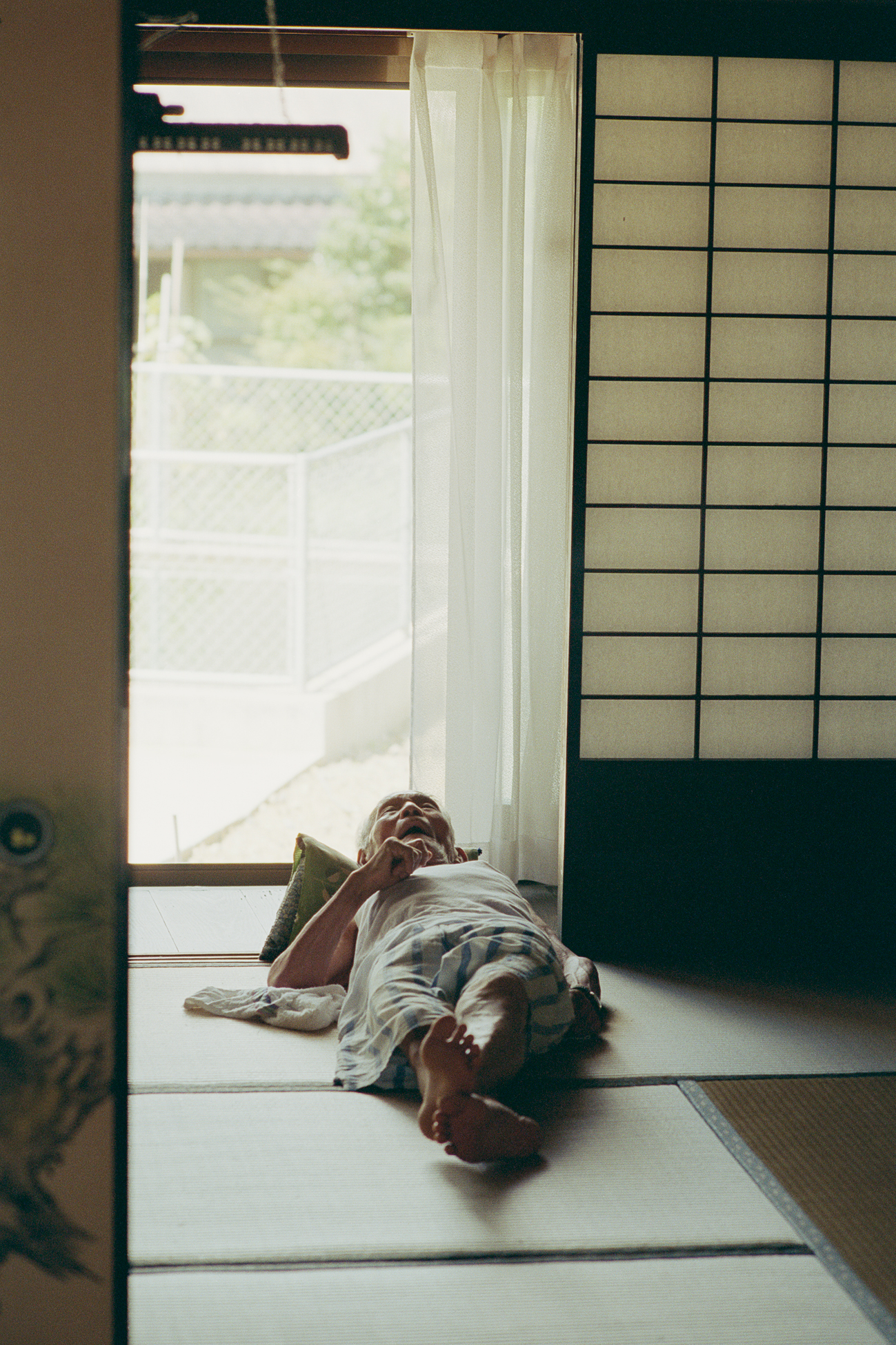 an old man lying down on the floor