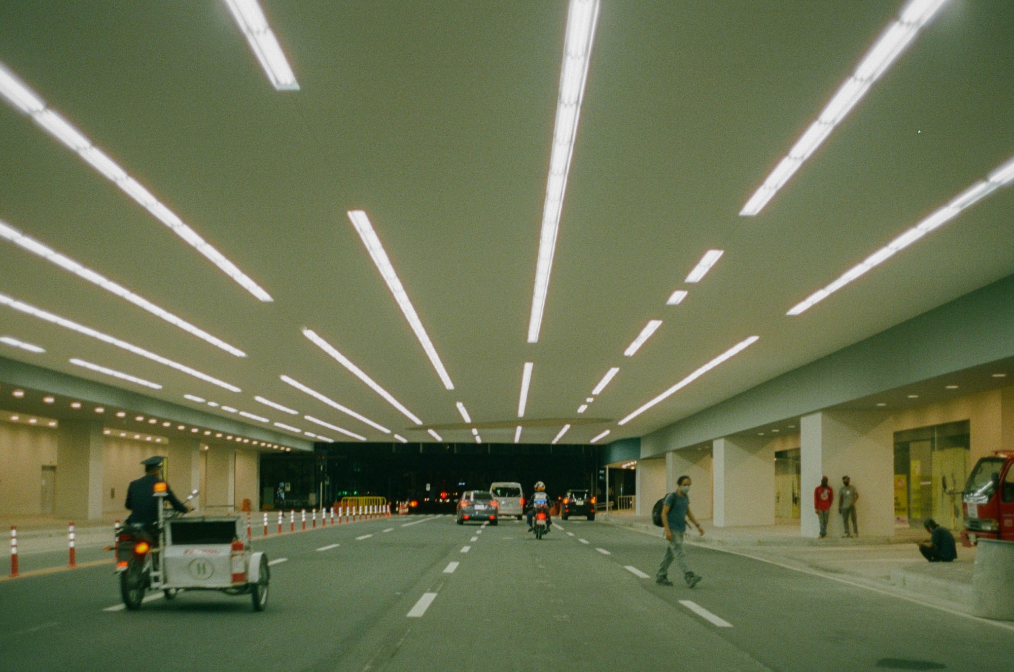 Busy road in a tunnel at night