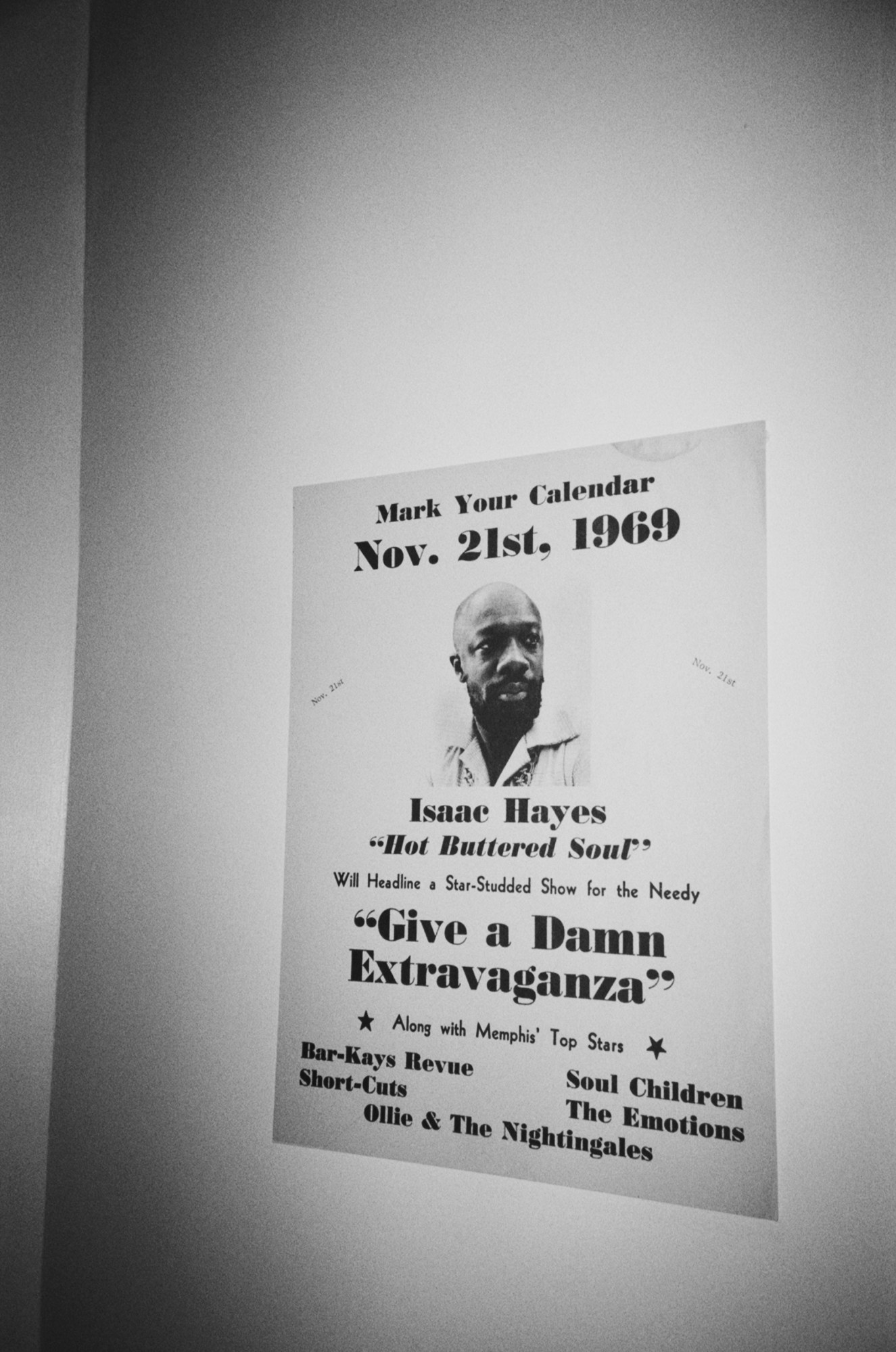 A poster on wall advertising a concert from 1969.