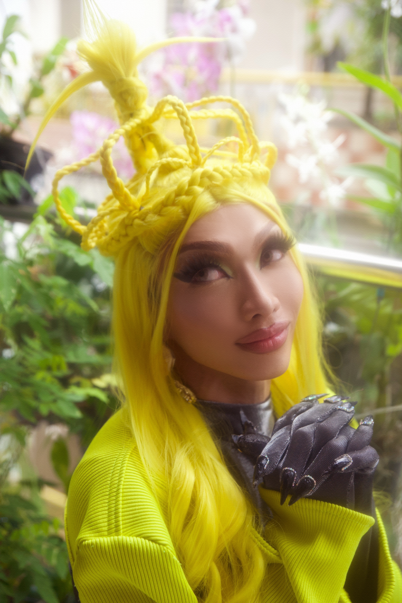 vietnamese drag queen onika zolanski with her hands clasped outside in ho chi minh city