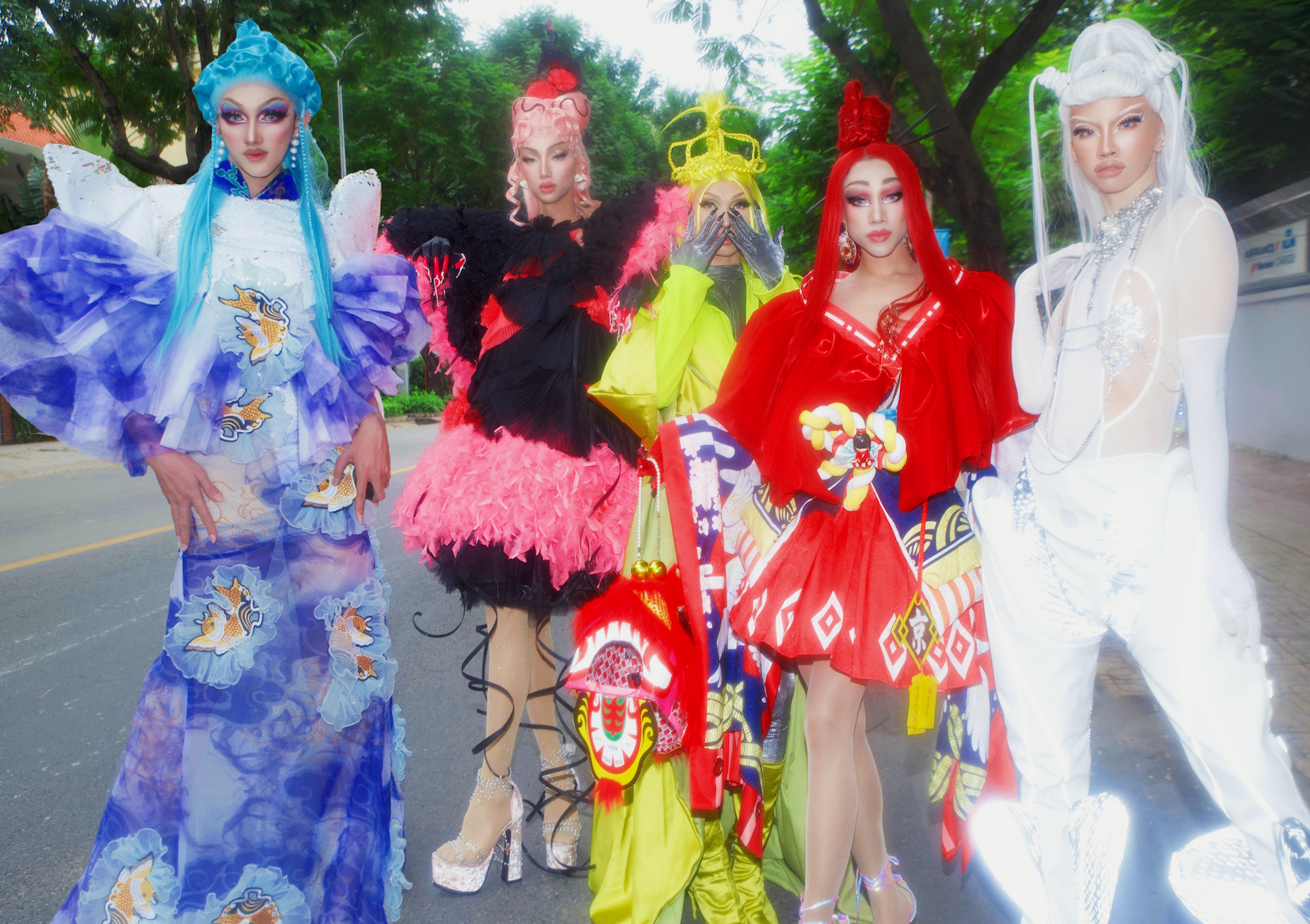 five drag queens crossing the street in ho chi minh city