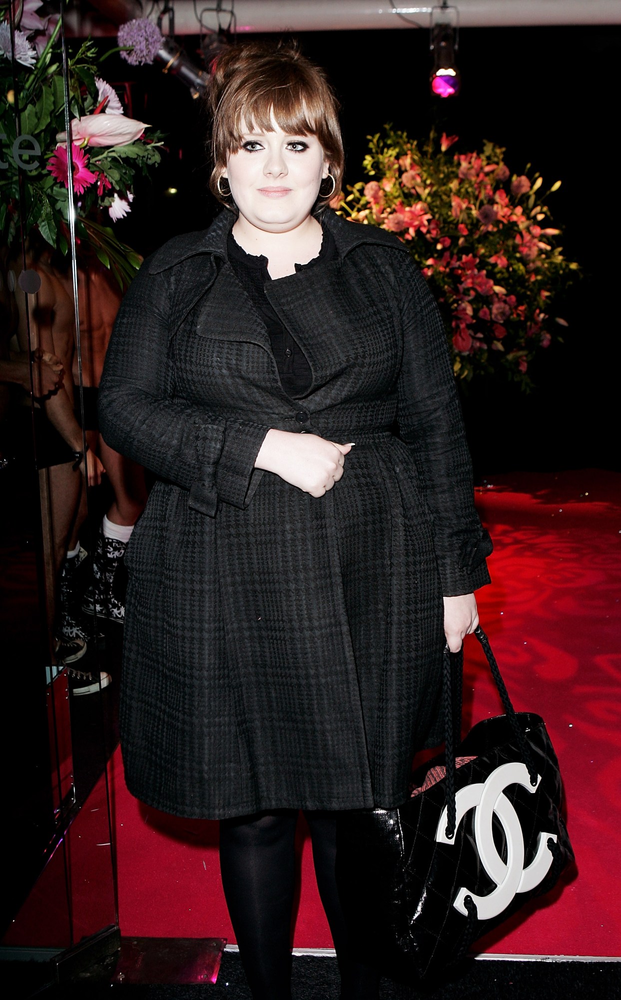 adele holding a chanel bag at an event in 2008