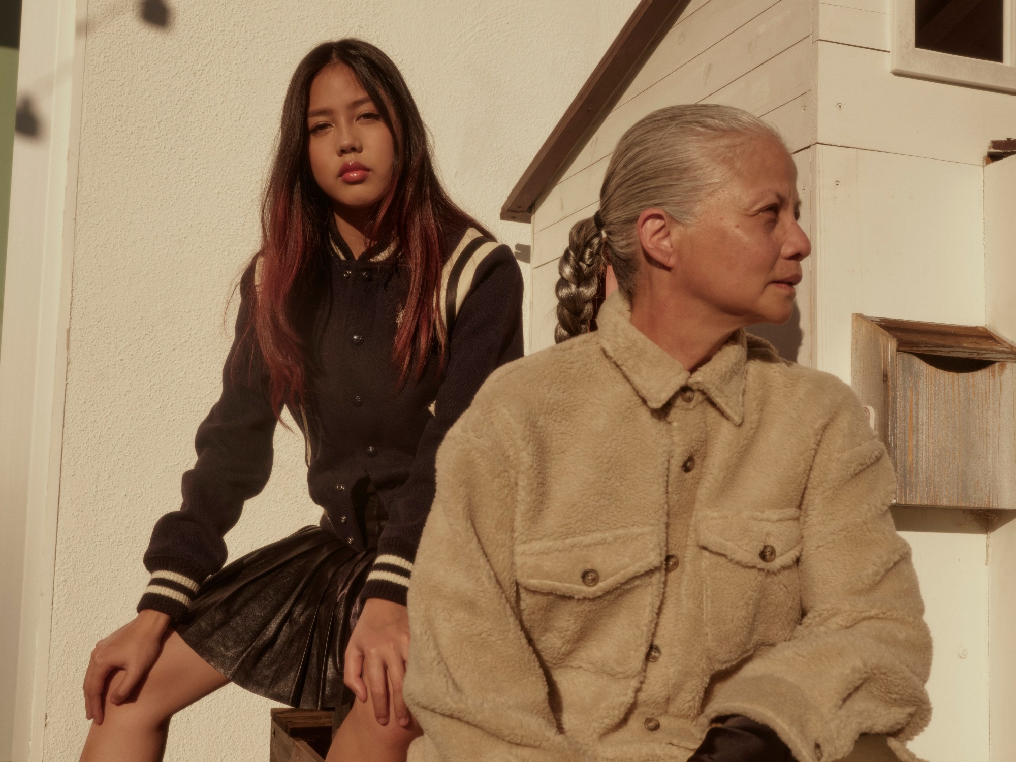 Emman sits with her mum on steps, both wearing Polo Ralph Lauren