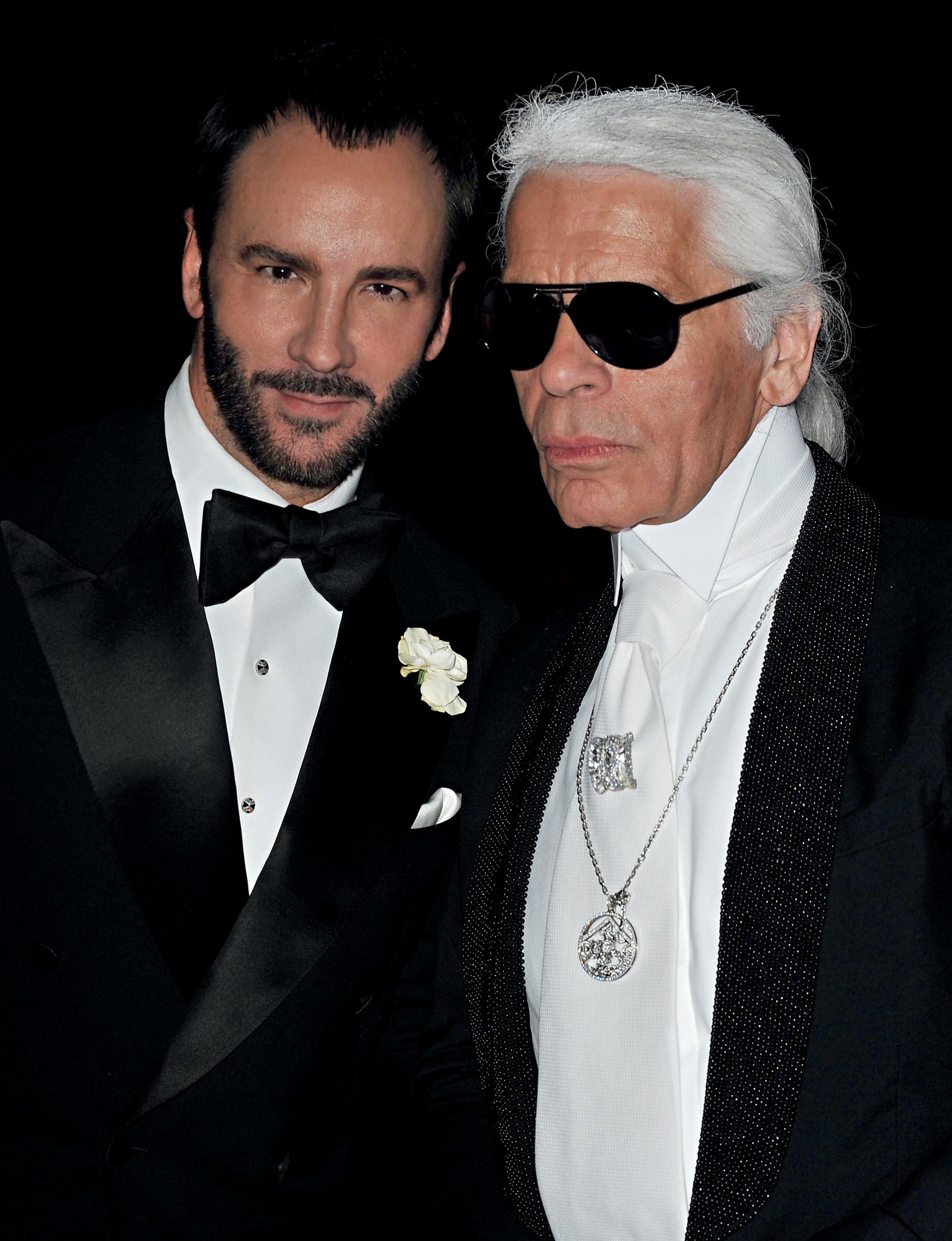 Tom Ford standing with Karl Lagerfeld.