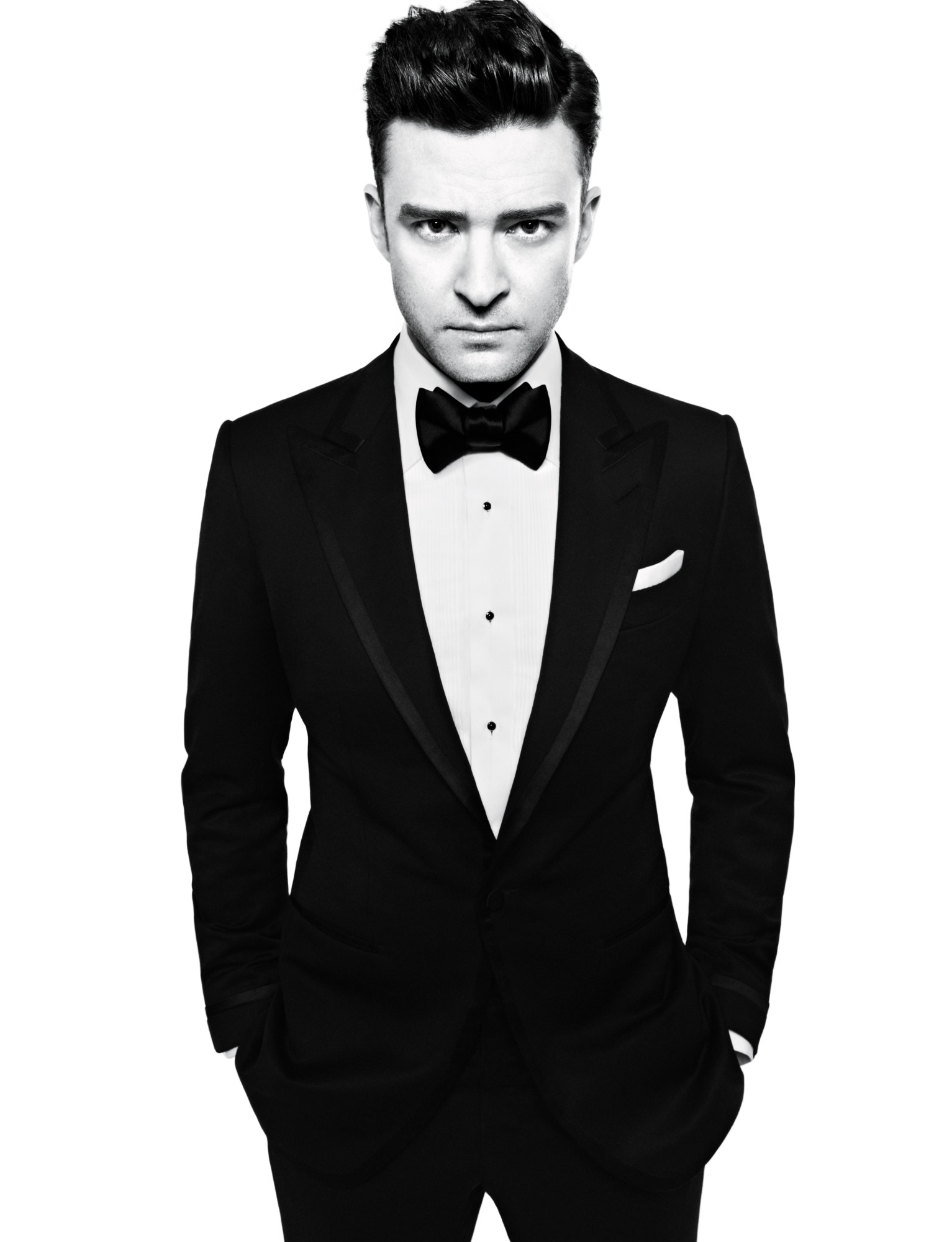 Justin Timberlake wearing a suit and bowtie with his hands in his pockets.