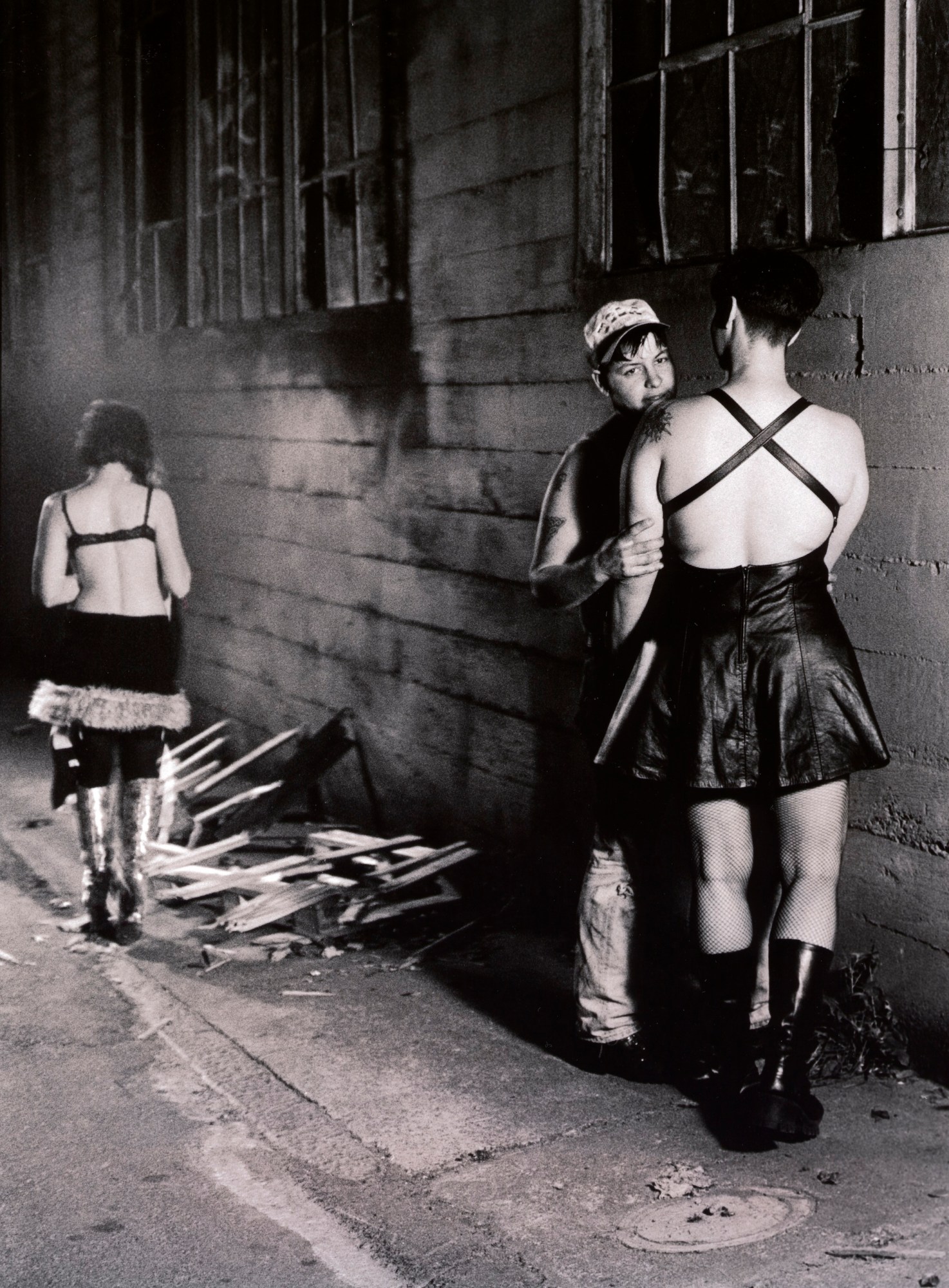 two lesbians embracing in an alleyway in san francisco