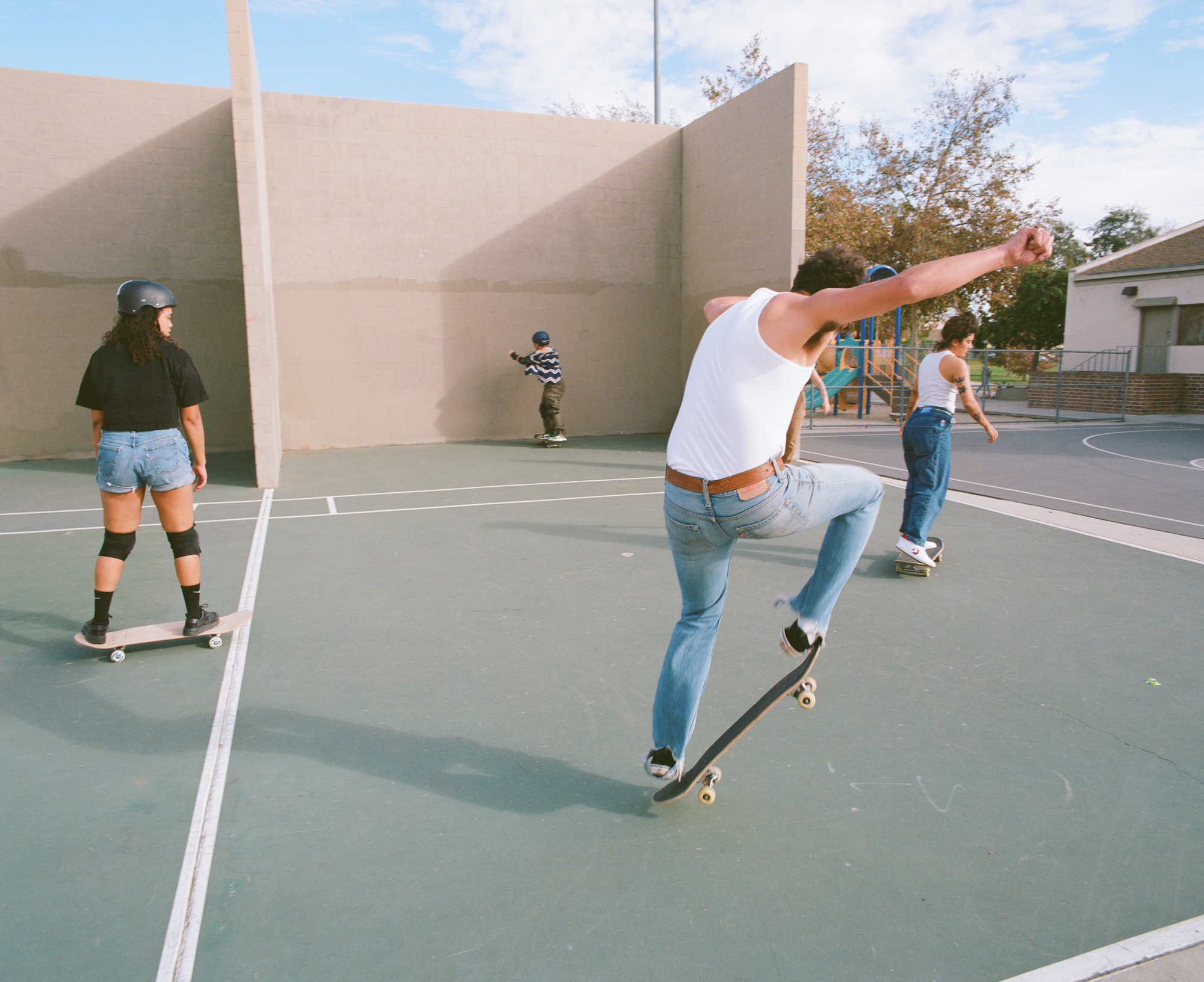 members of queer skate collective boos cruise skating at the park