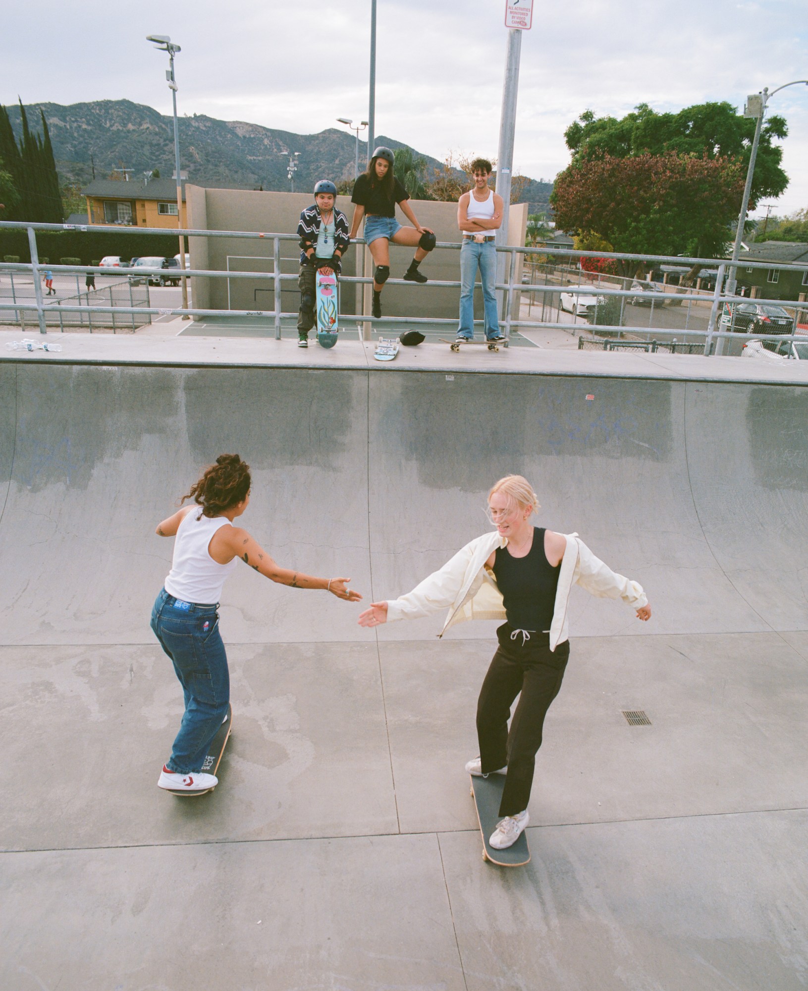 members of boos cruise skating on a ramp in la