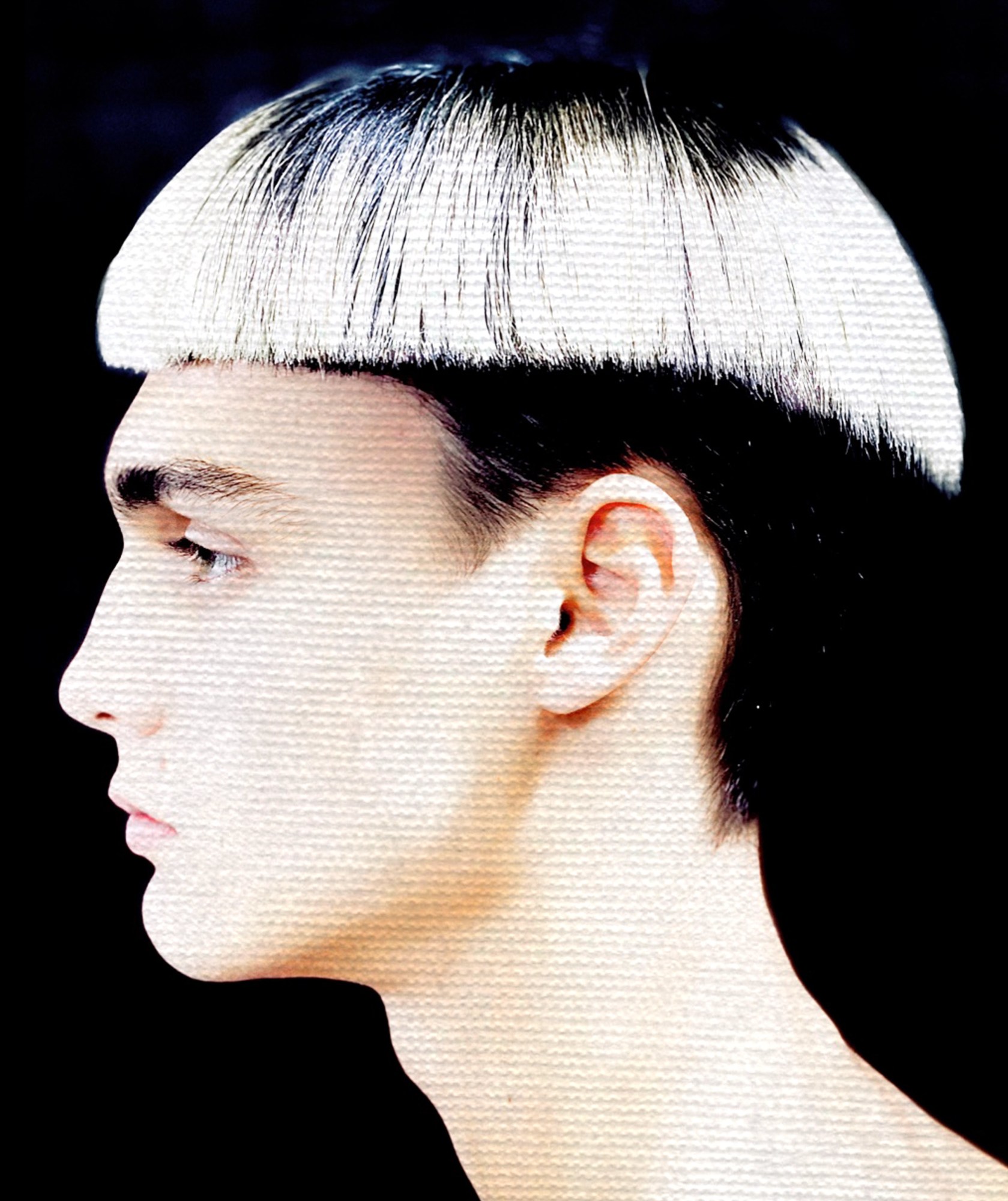 A model with a white bowl cut