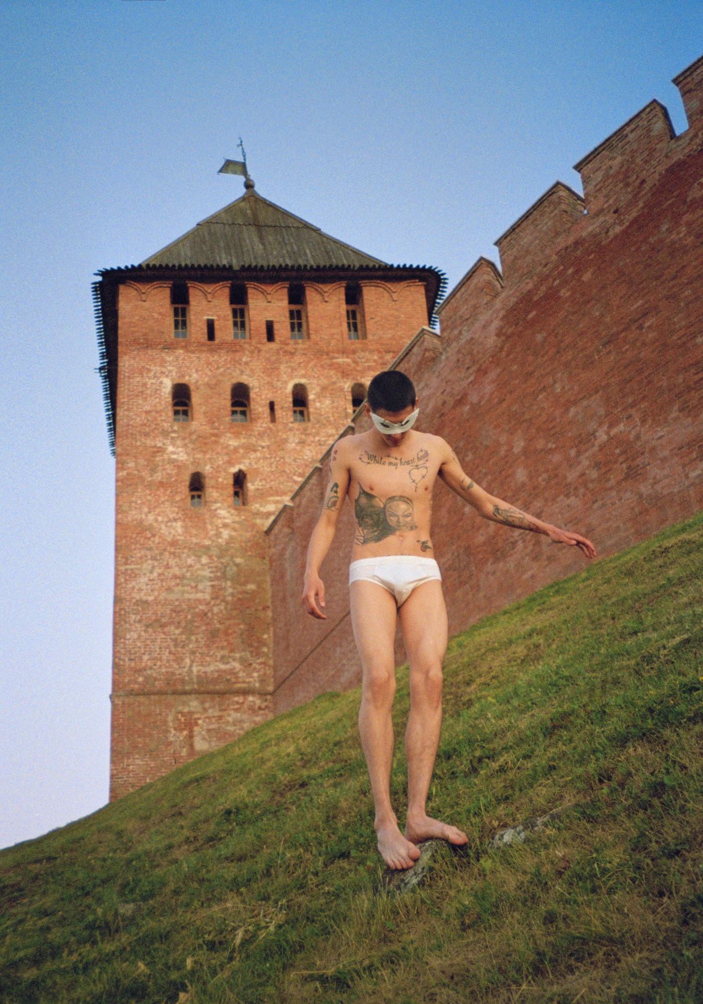 vlad zorin's portrait a boy in underwear outside novgorod kremlin