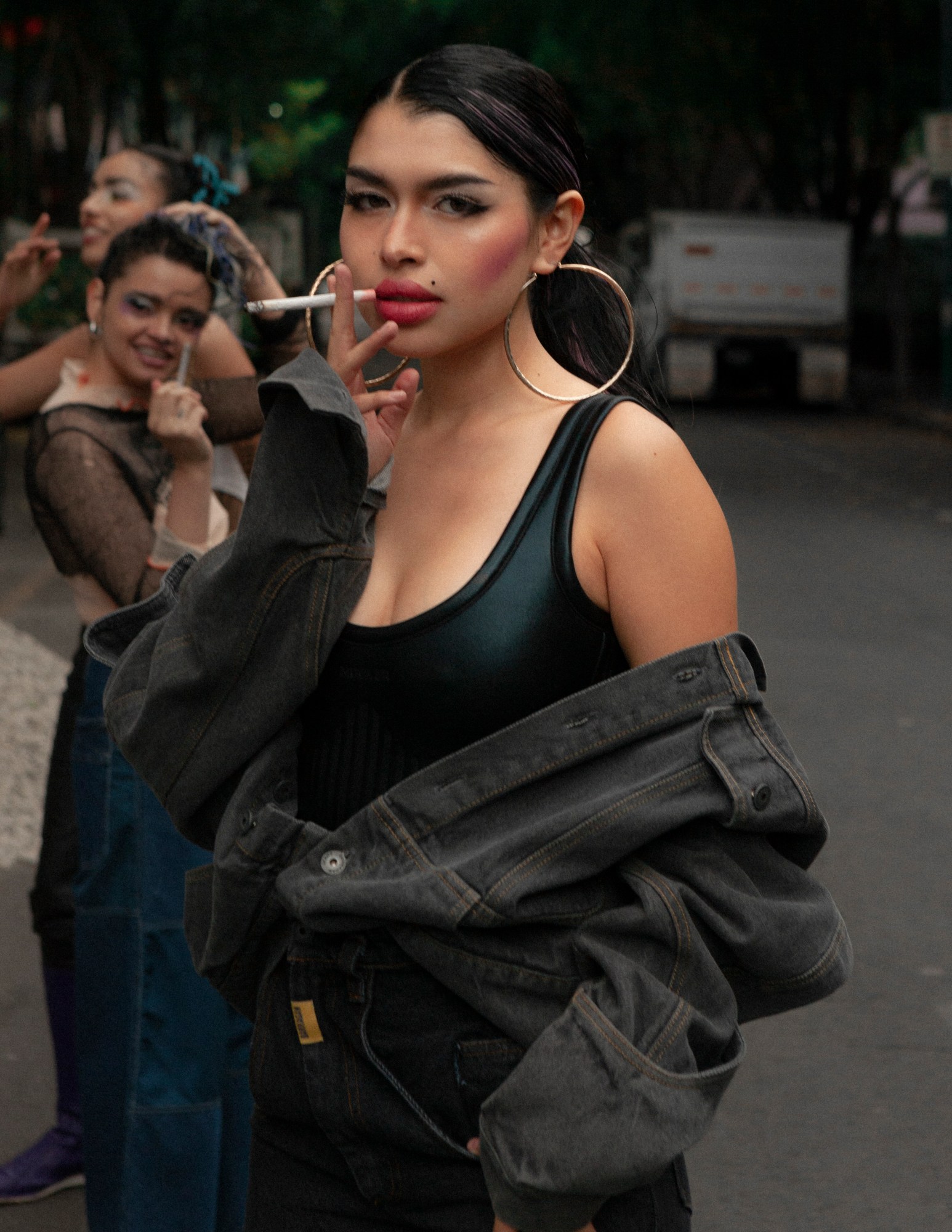 model ana karen smoking a cigarette in the streets of mexico city