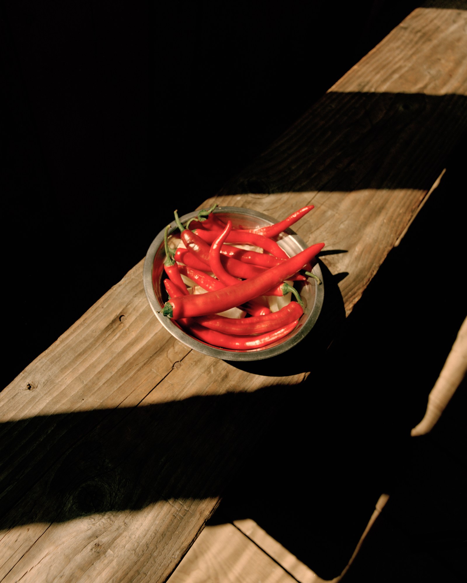 a bowl of red chiilis