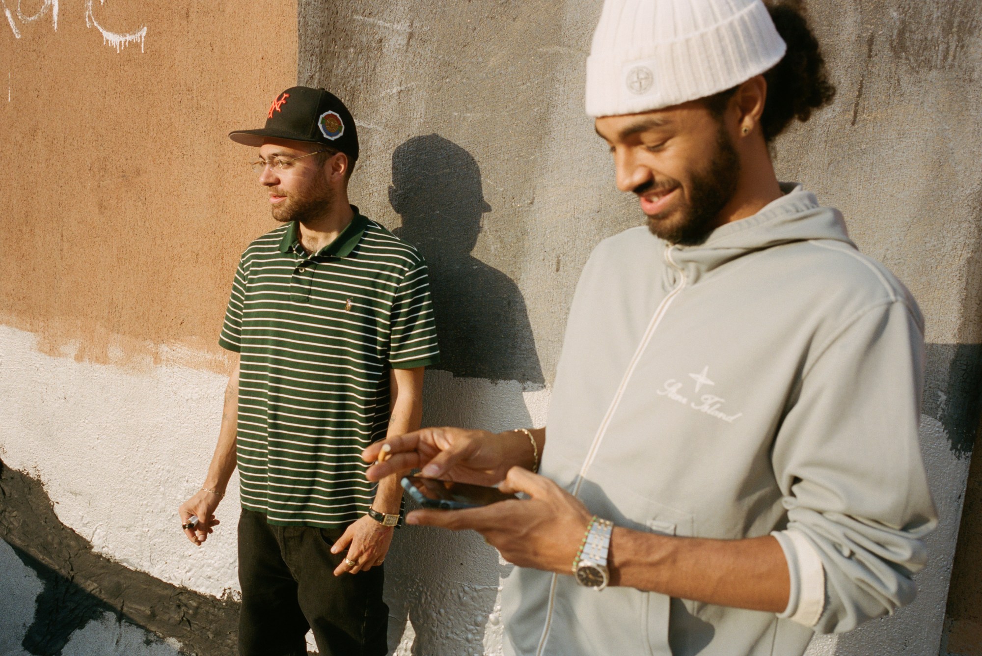 wiki and sage elsesser standing on a new york rooftop smoking